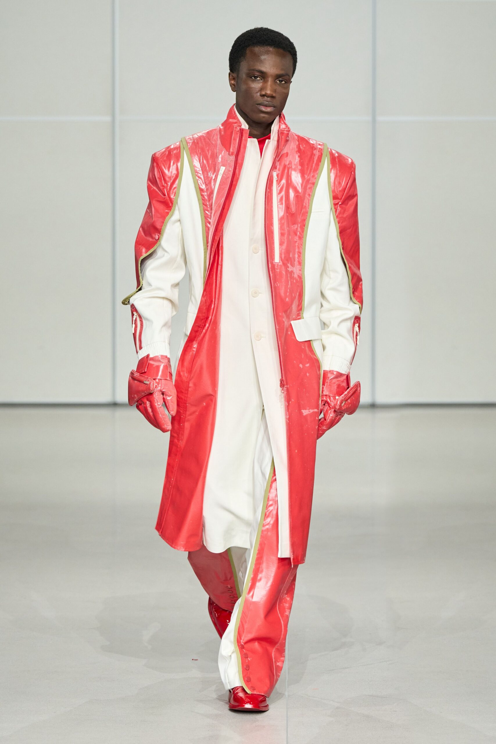 red vinyl long-sleeve collared fitted zippered layered coat