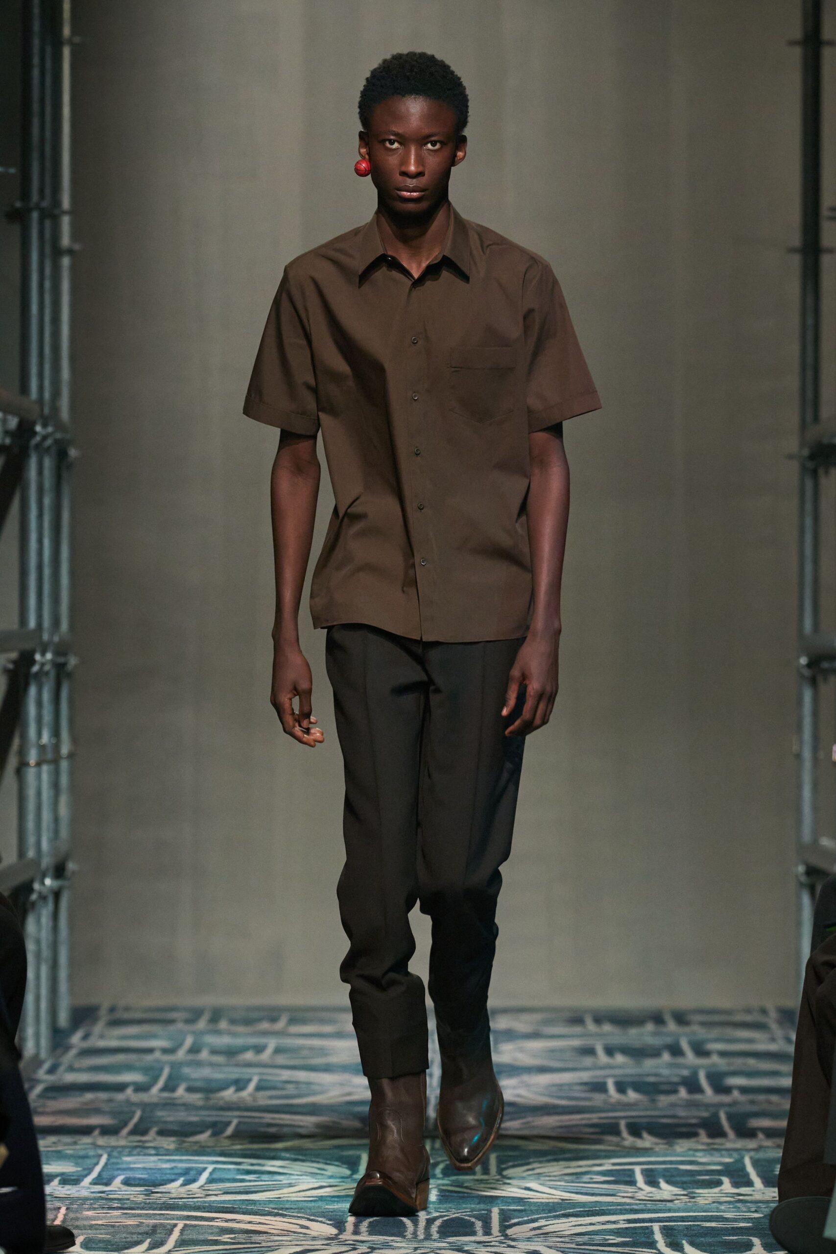 brown shirt black pants brown boots