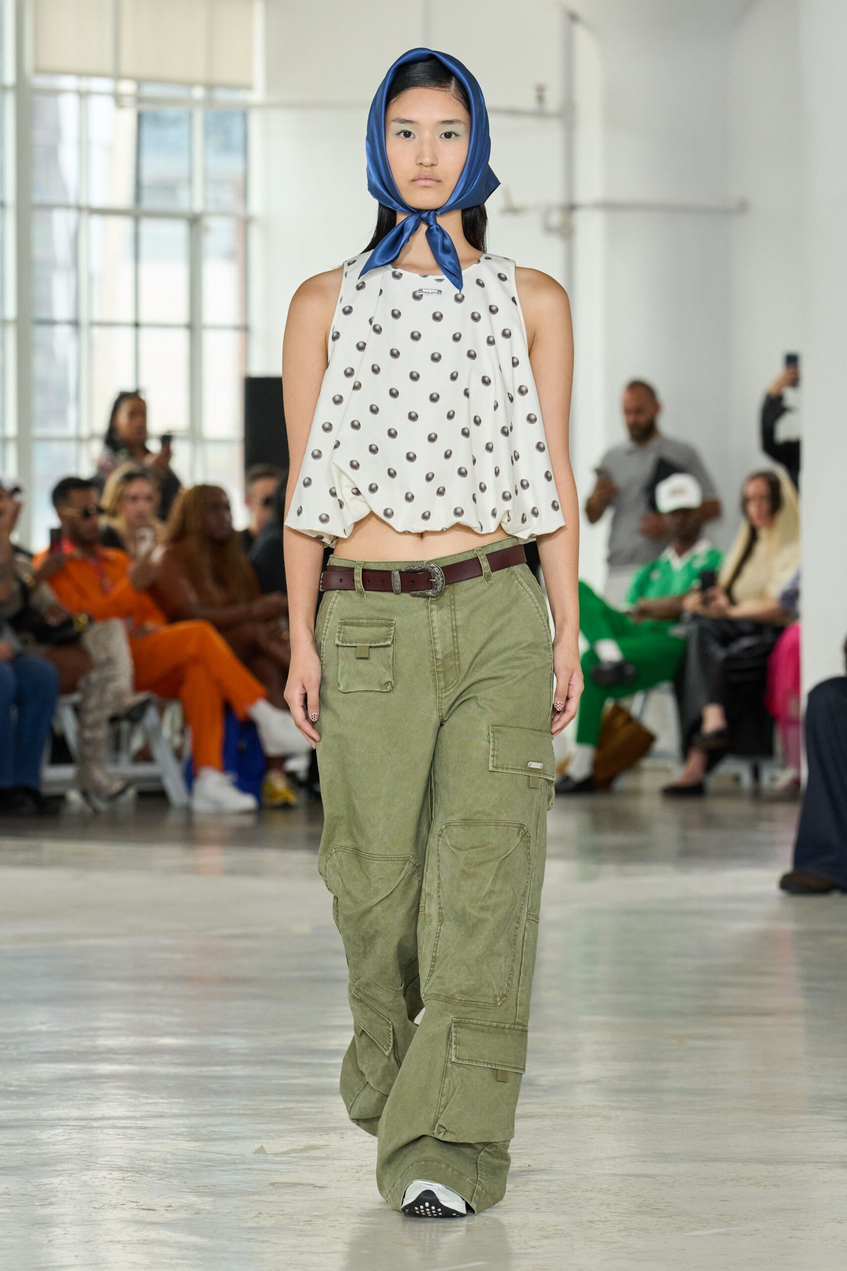 white polka-dot top with cargo pants