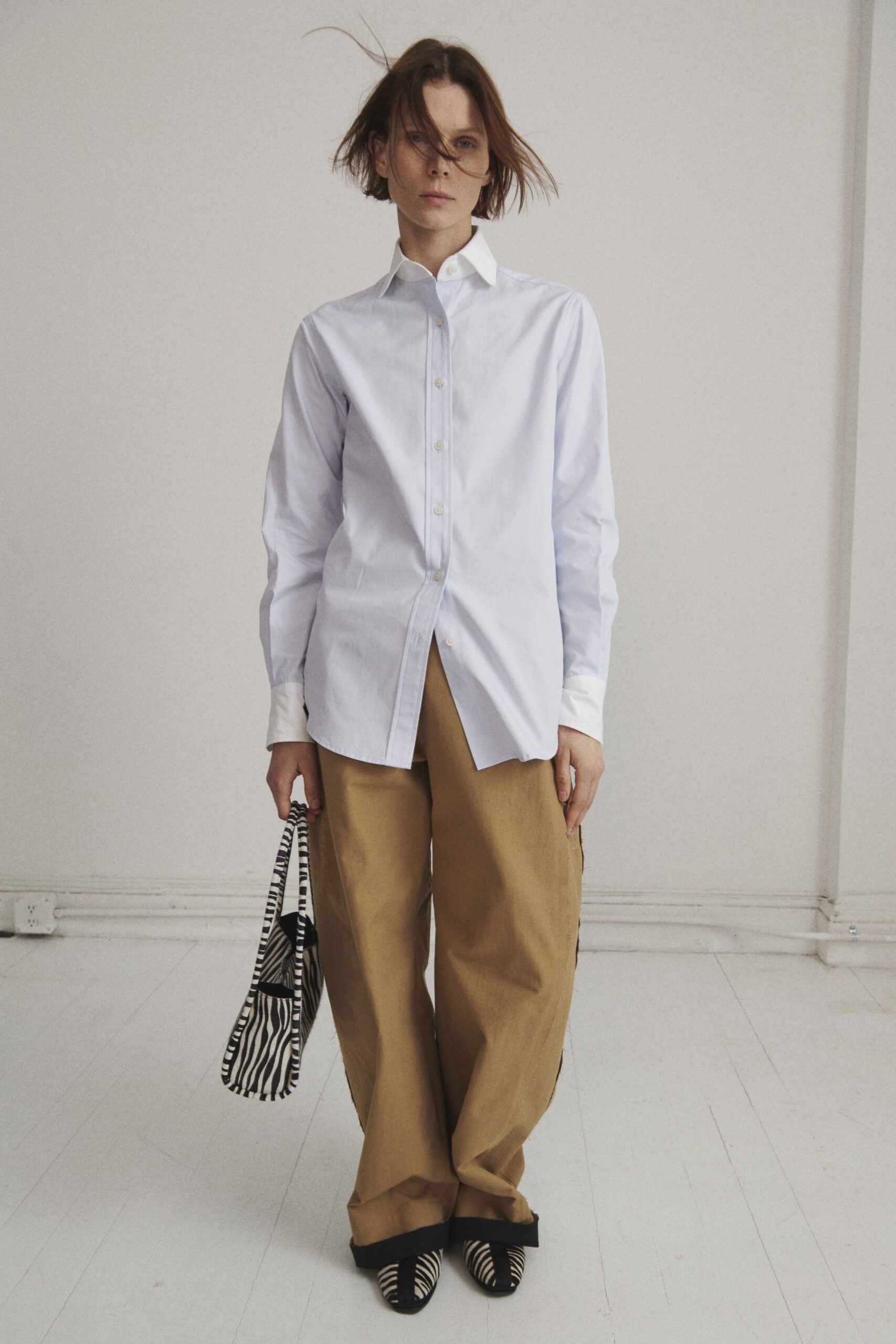 white relaxed shirt with beige cargo pants