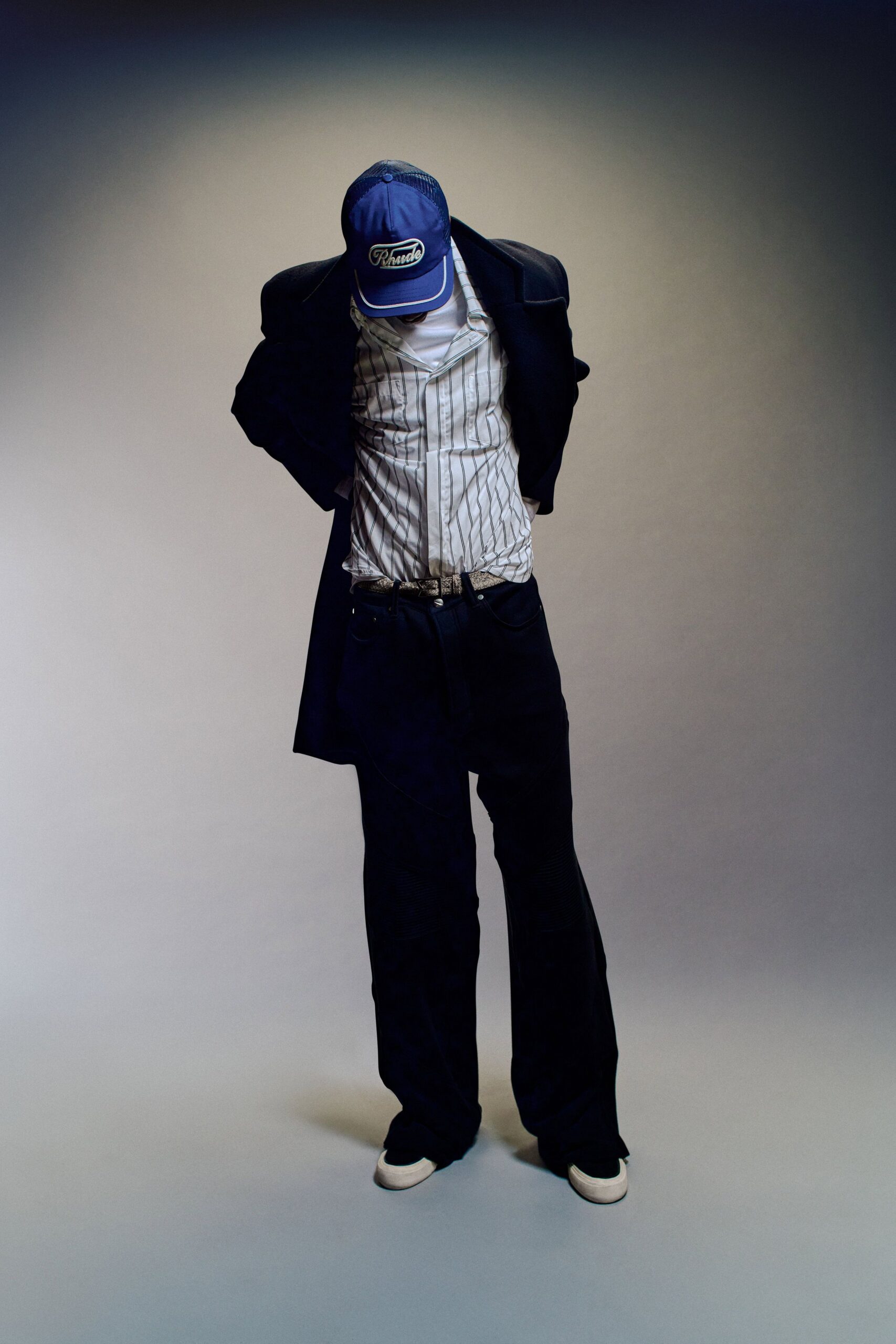 black coat with striped shirt and pants