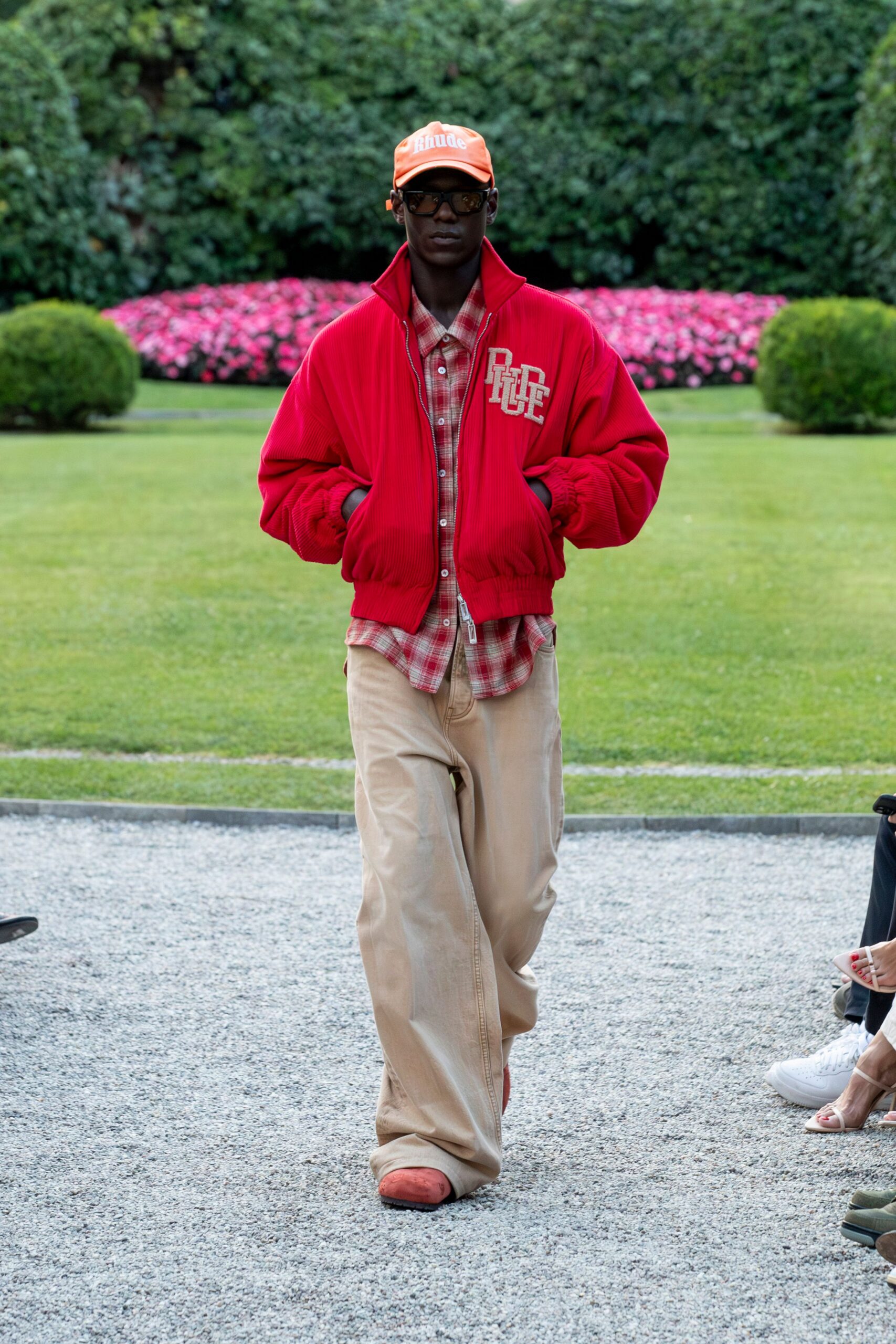 red jacket with beige pants