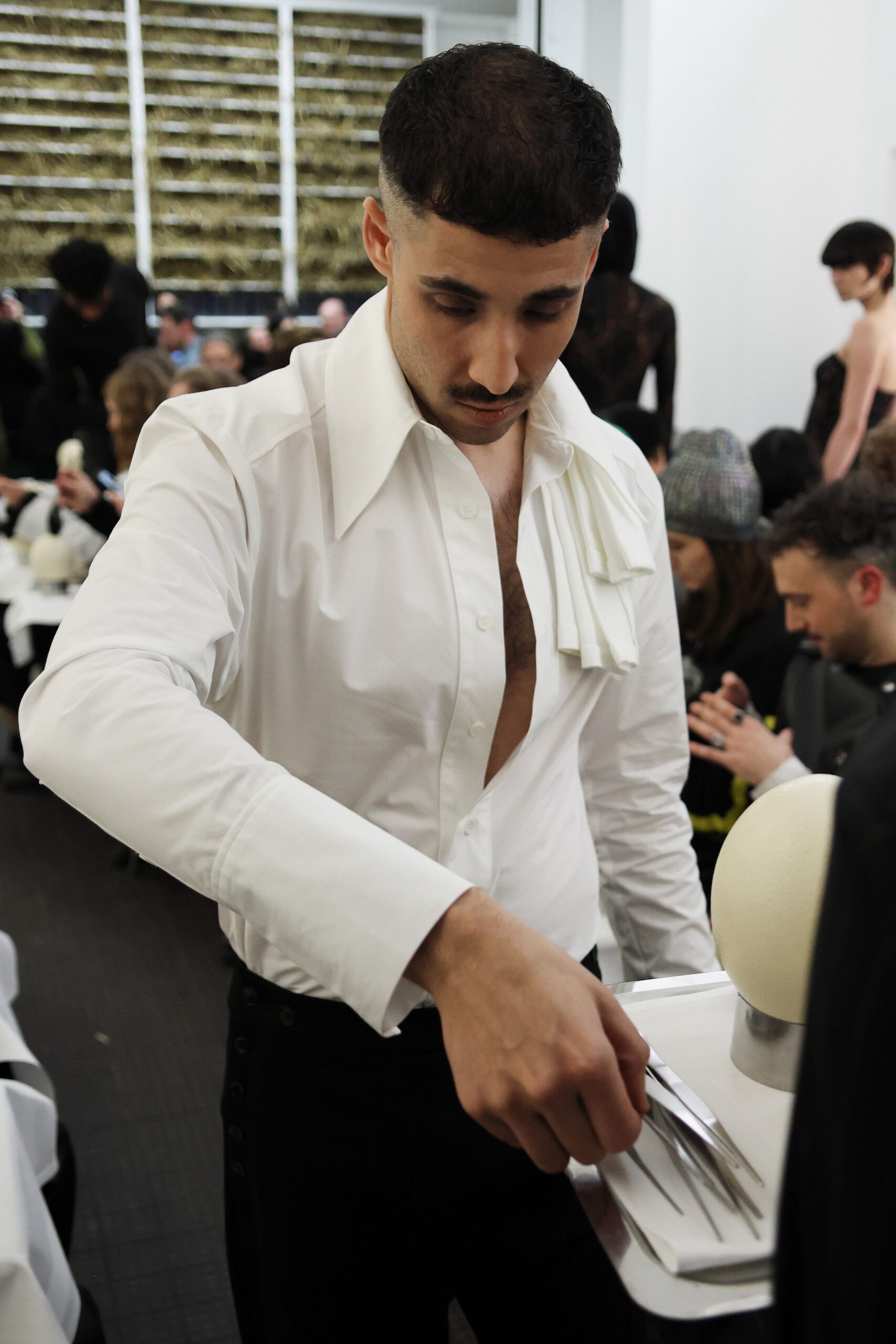 white fitted shirt and black pants