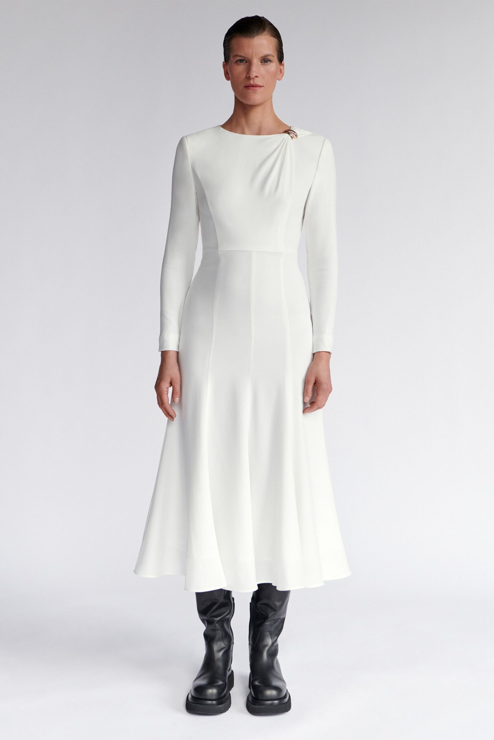 white fitted midi dress with black boots