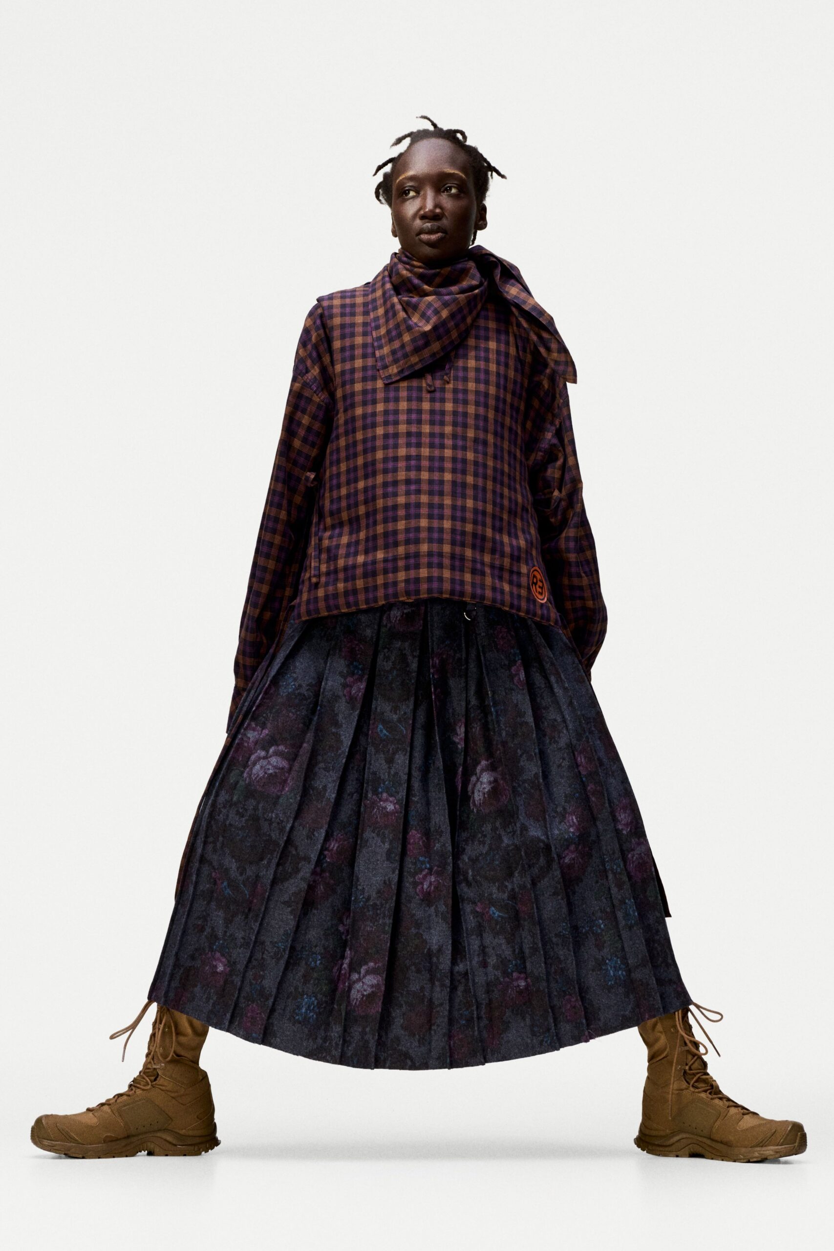 purple checked top black pleated skirt
