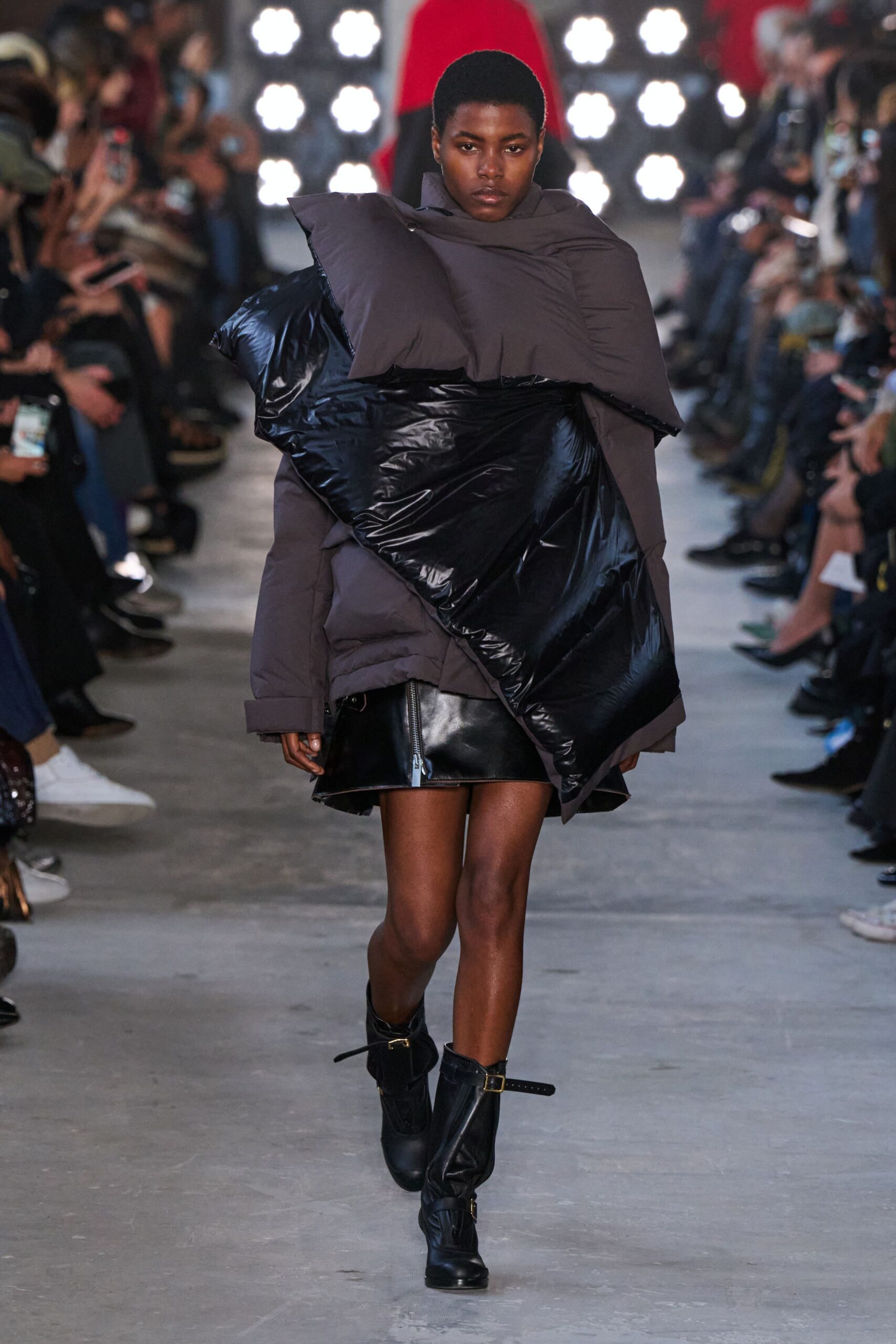 gray faux-fur jacket with black leather mini skirt