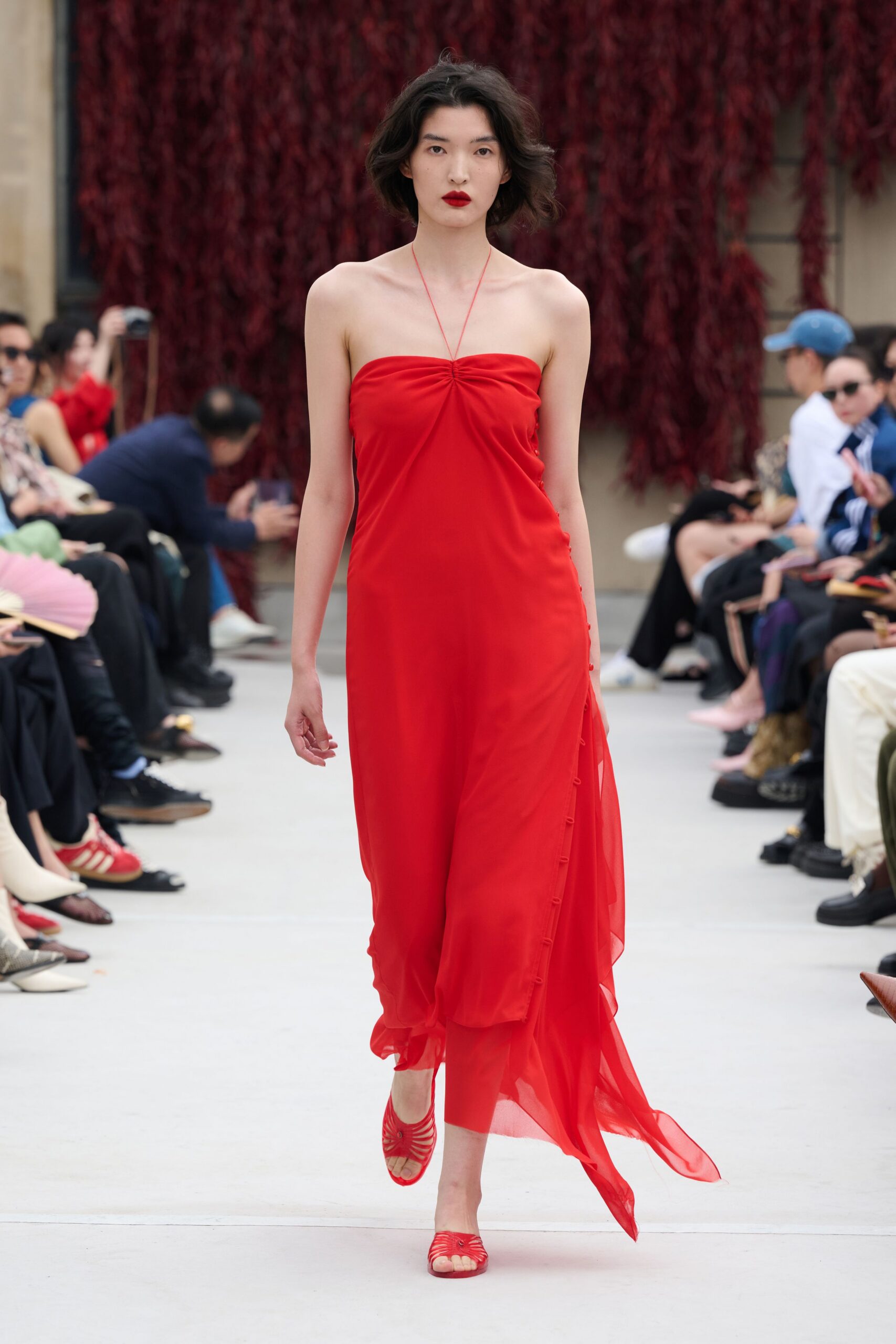 red silk strapless fitted flowing maxi gown