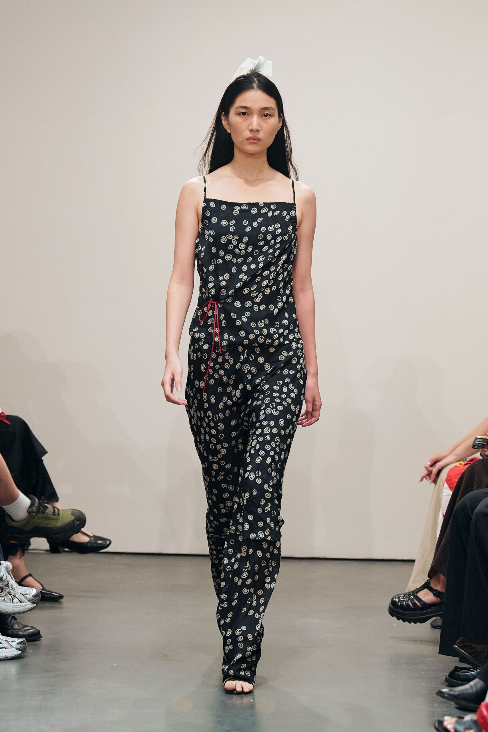 black floral jumpsuit with strappy shoes