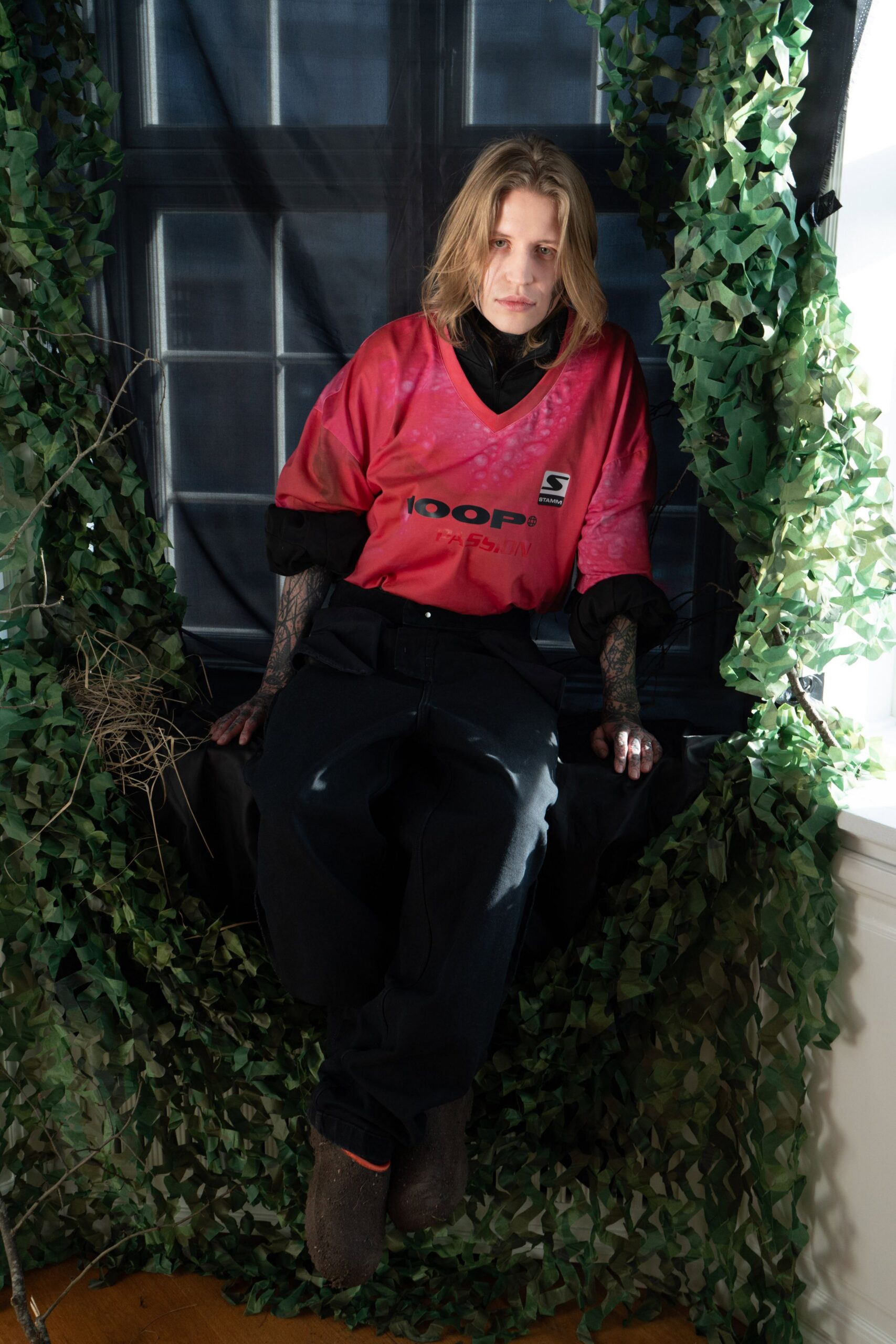 red relaxed top with black pants