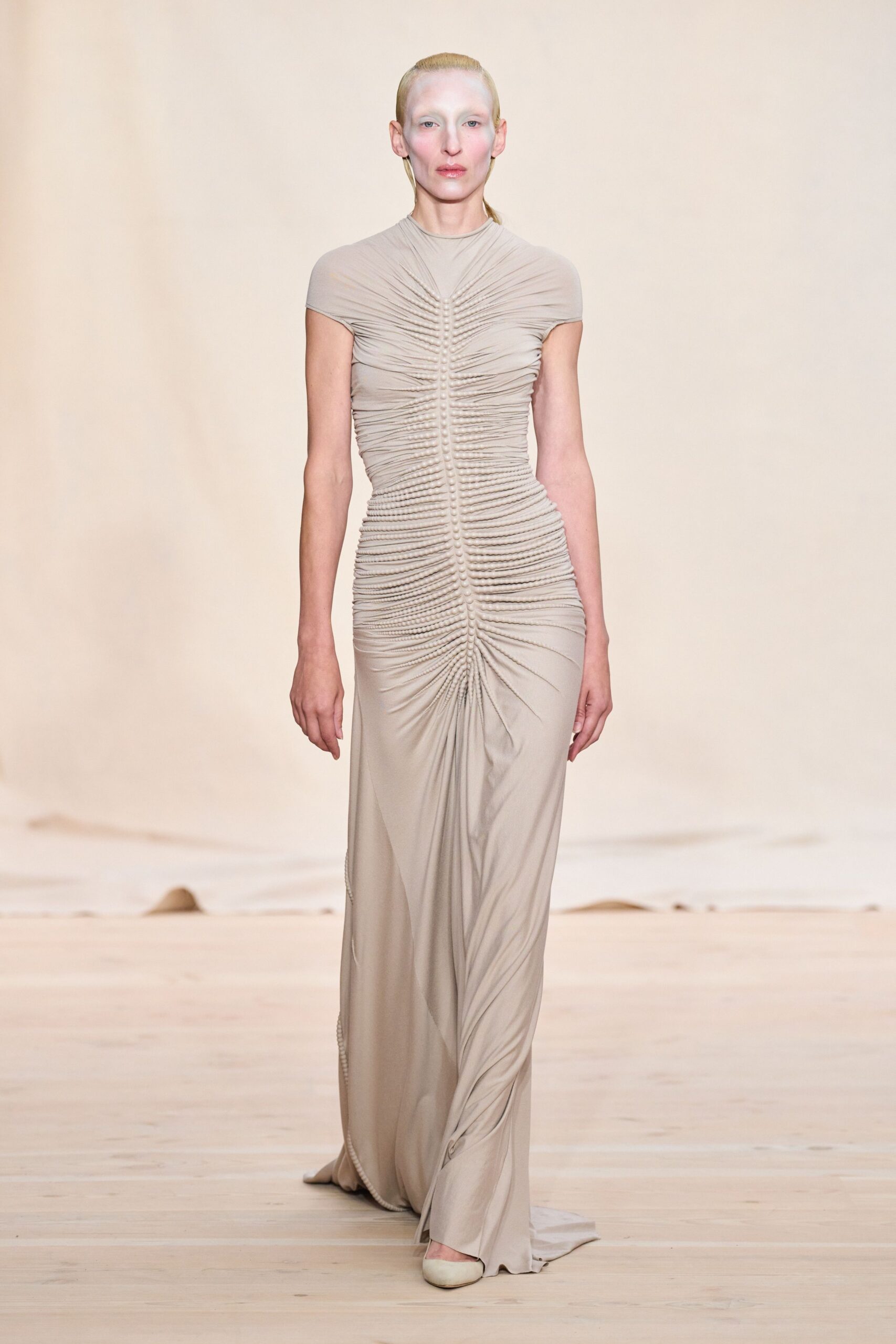 beige fitted sleeveless gown
