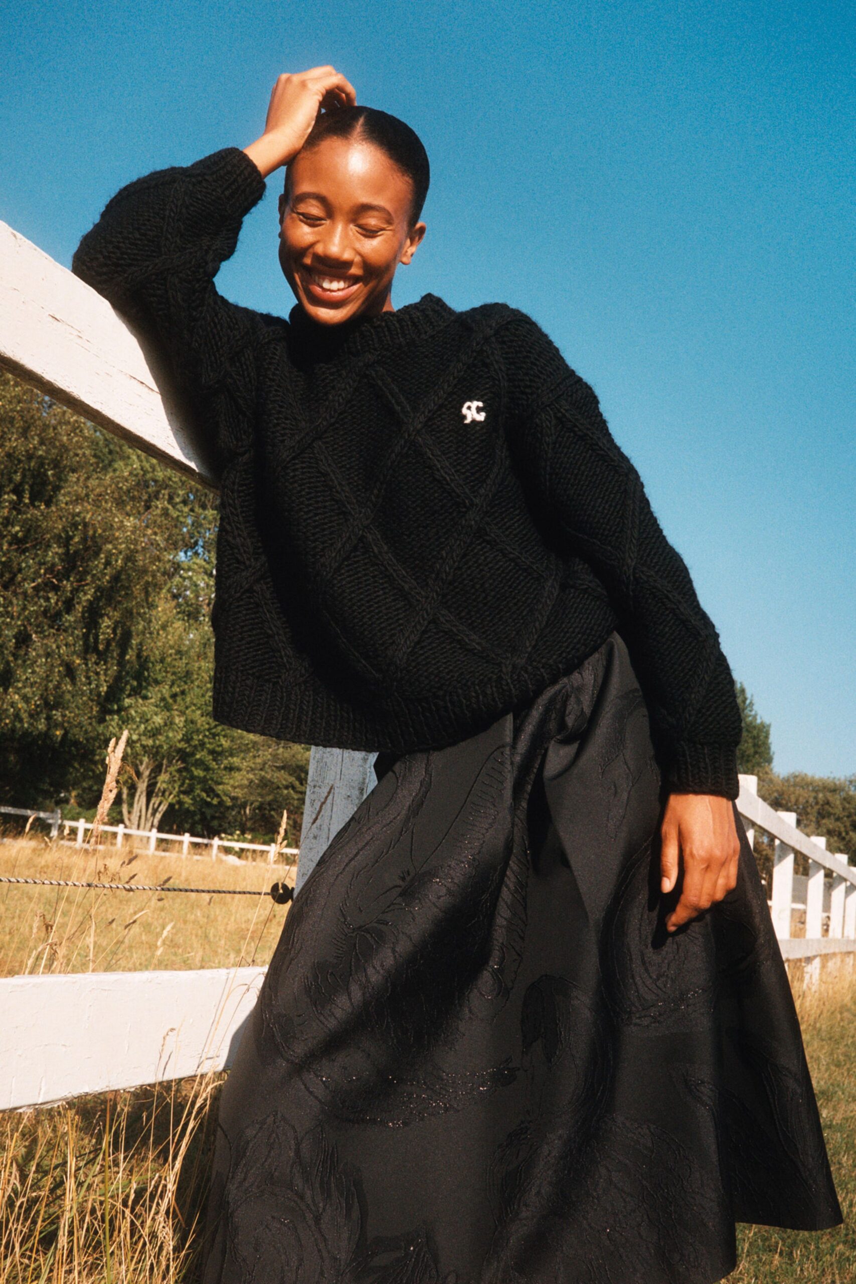 black wool long-sleeve collared relaxed textured sweater