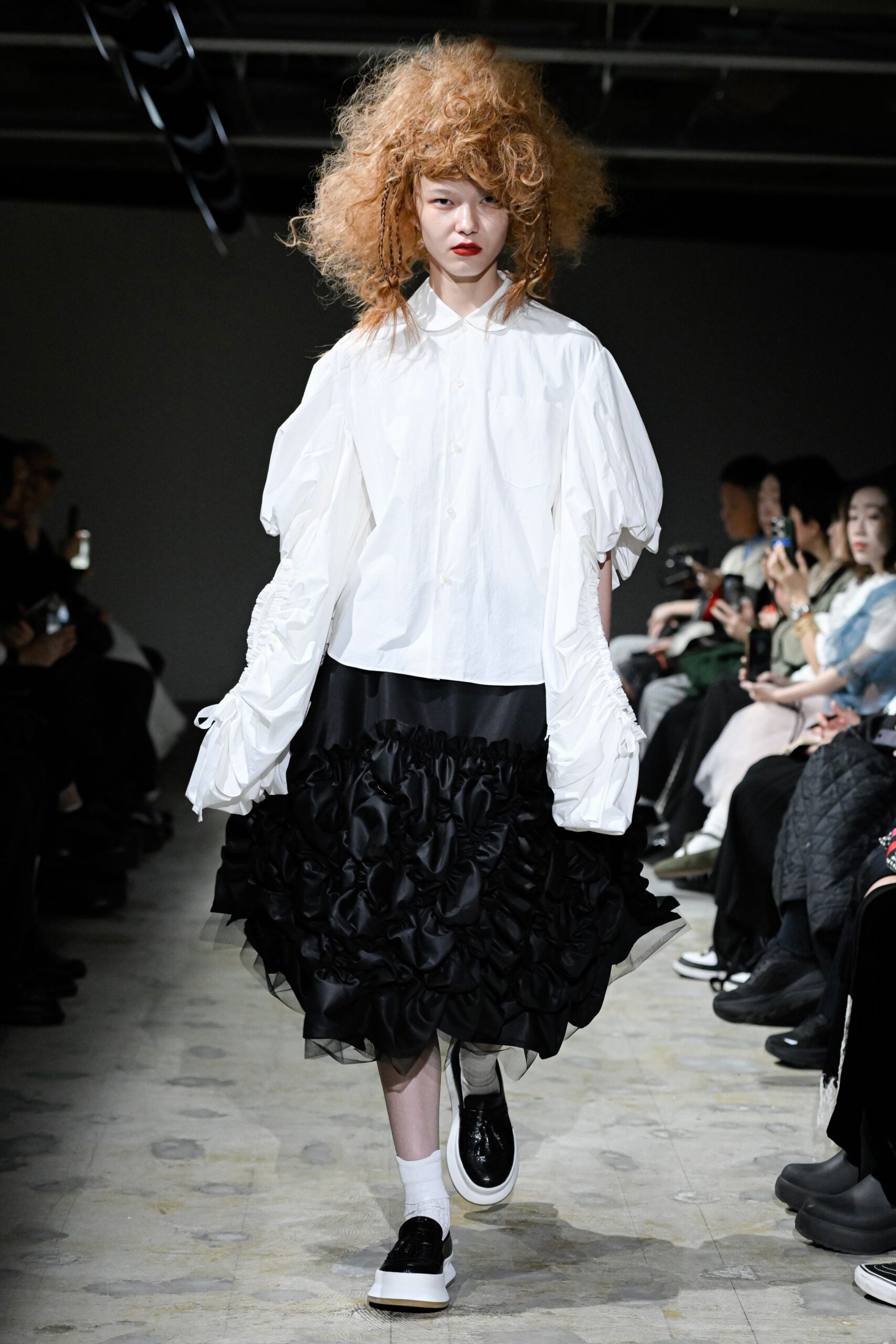 white relaxed shirt black ruffled skirt