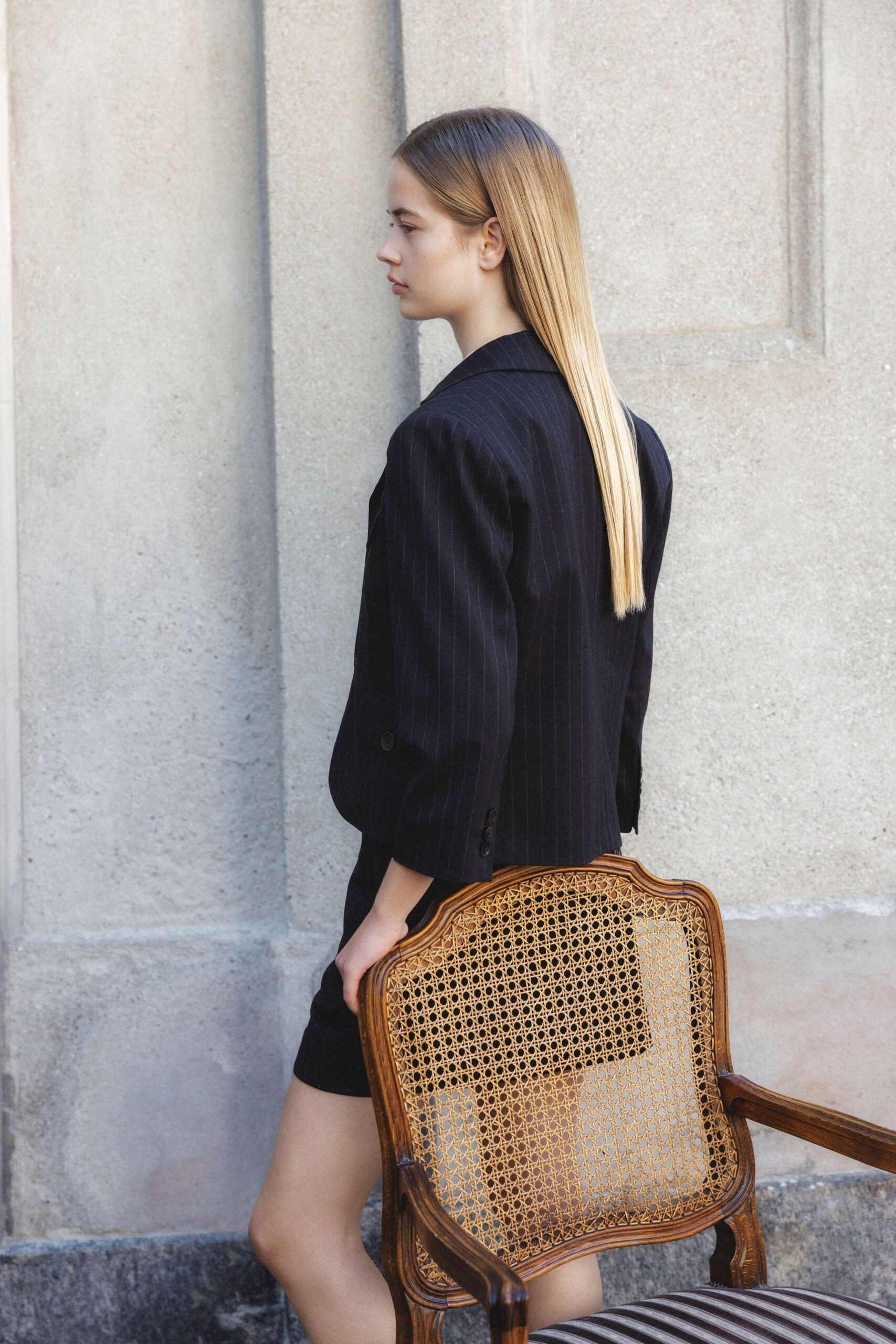 black structured blazer and fitted mini dress