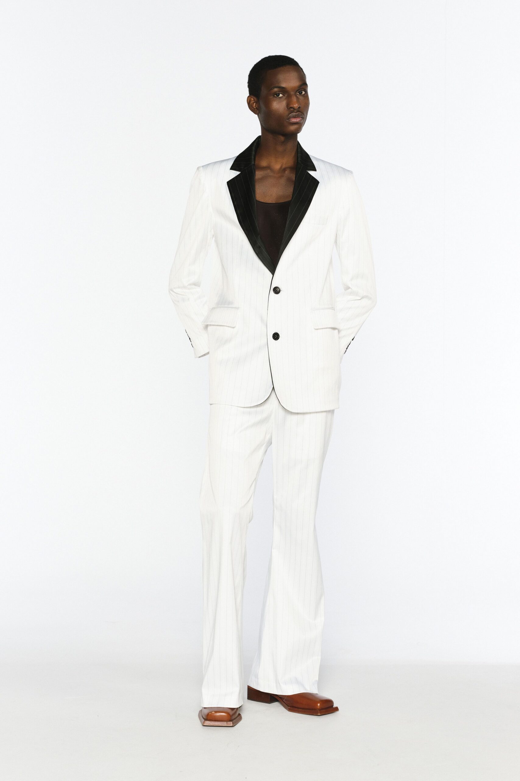 white tailored suit with black shirt