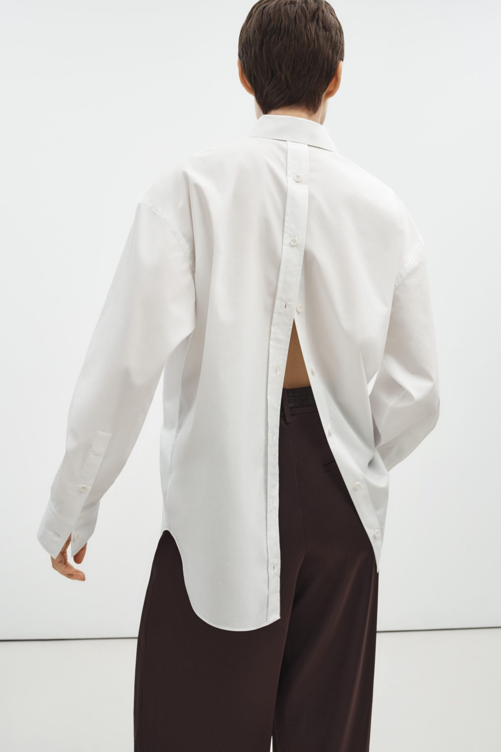 white relaxed shirt with brown pants