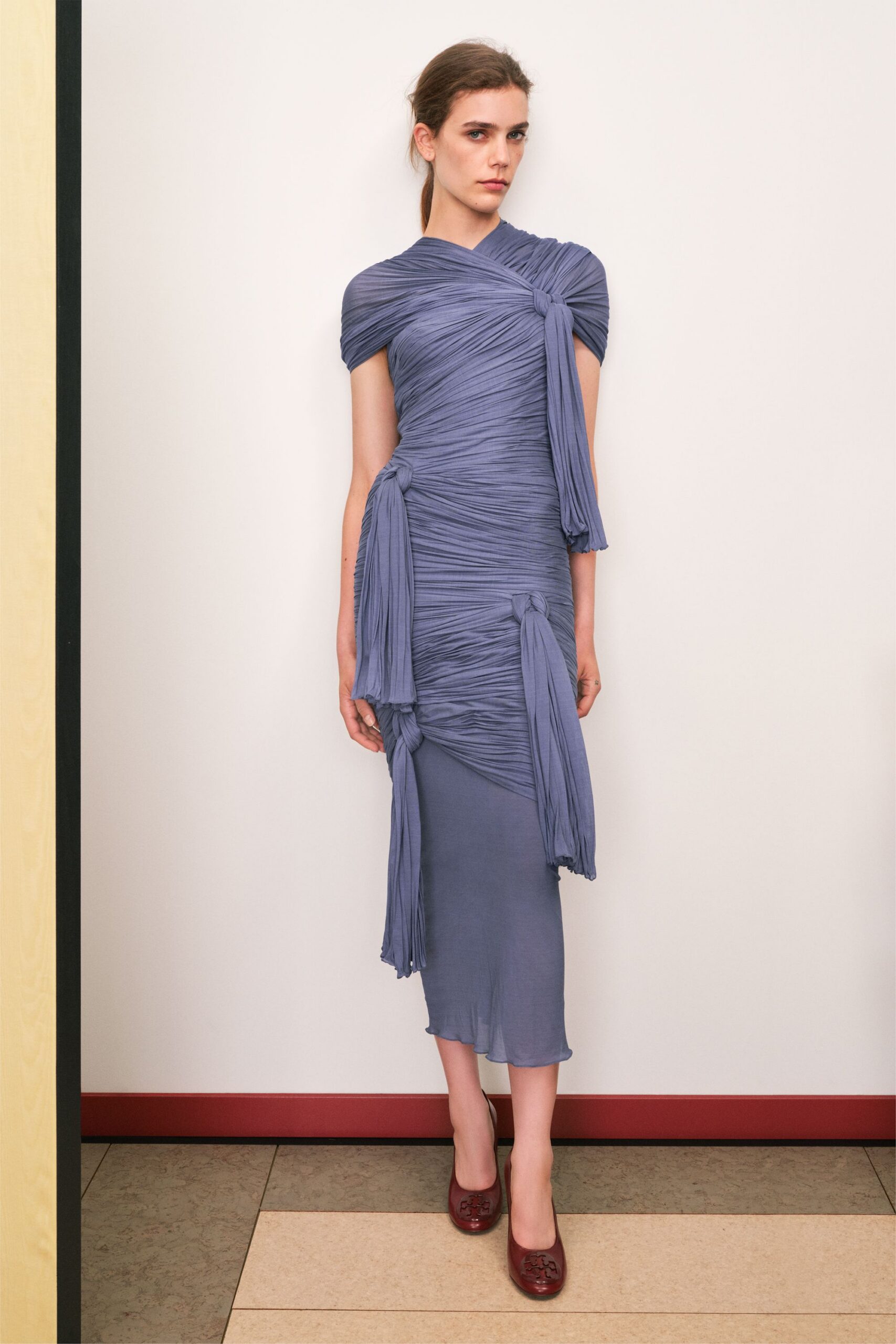 blue silk ruched midi dress with red shoes