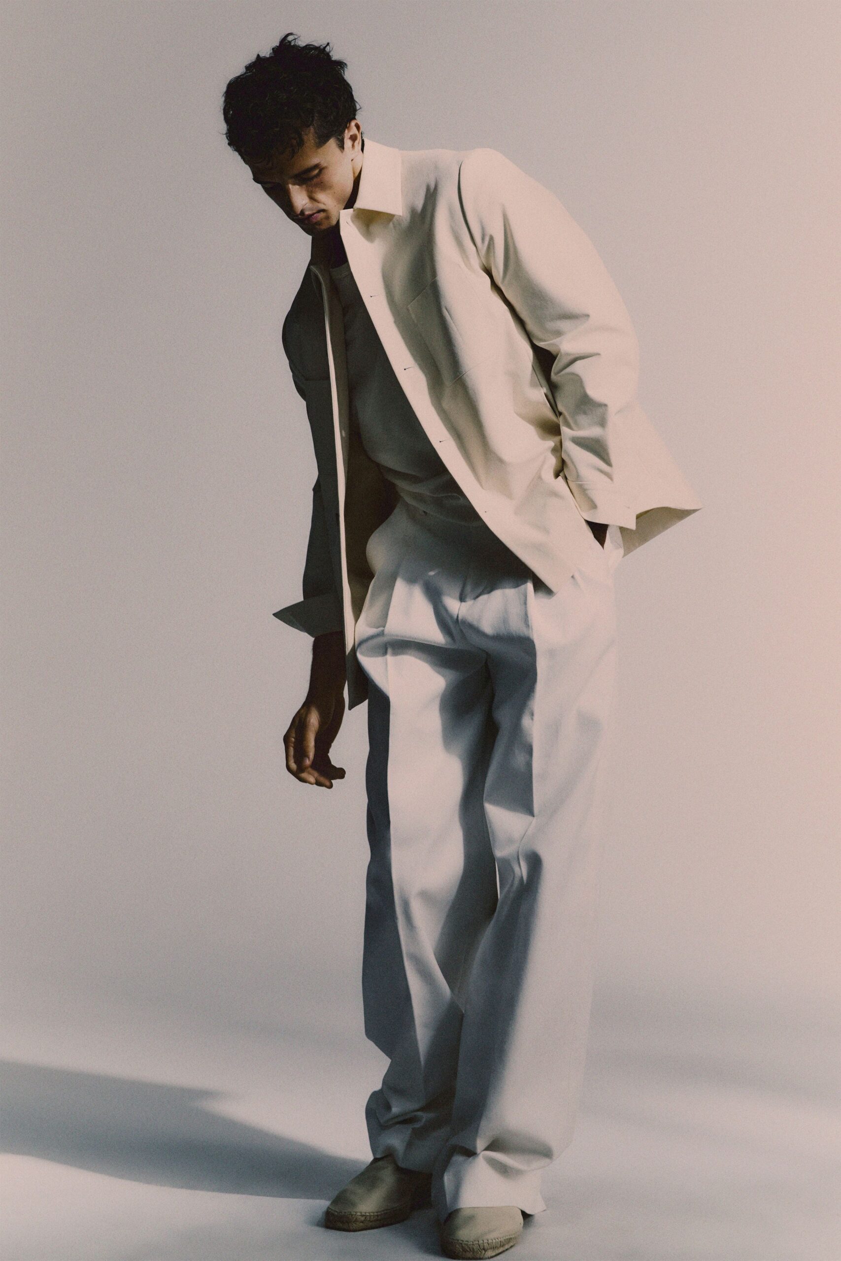beige relaxed shirt and white pants