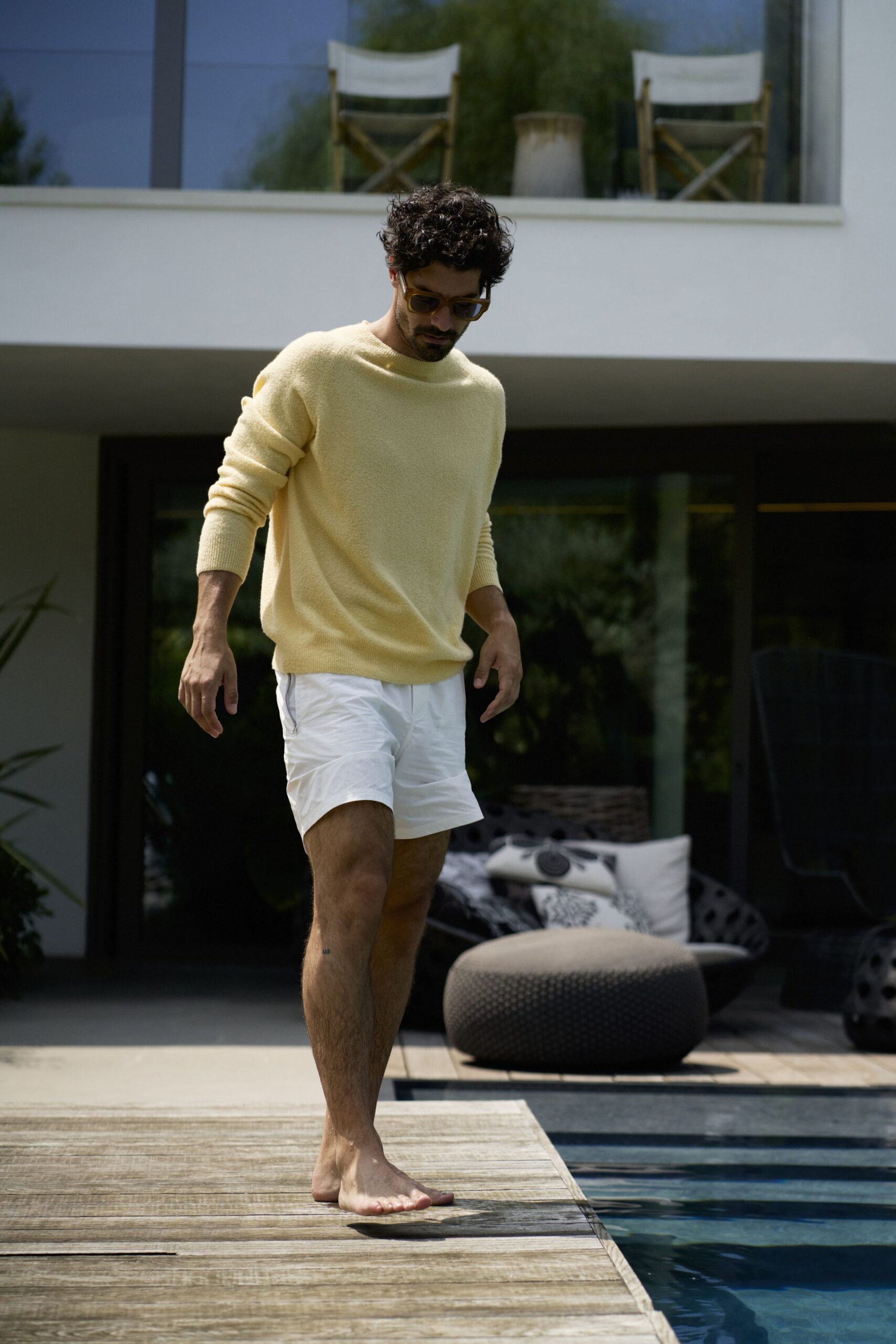 yellow cotton sweater with white shorts