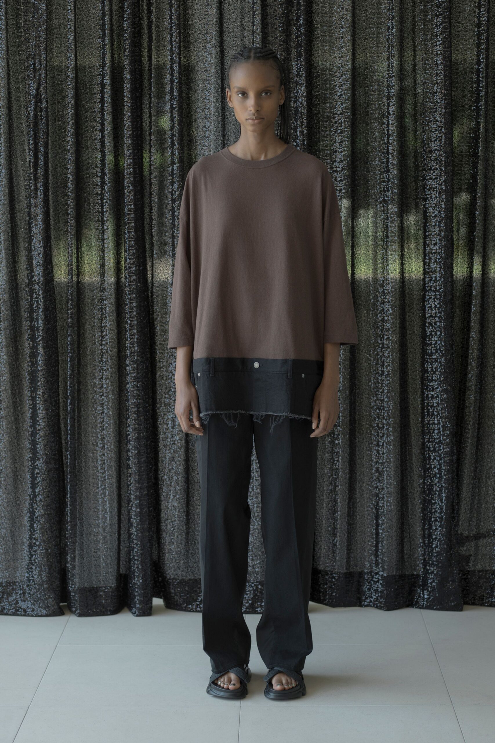 brown layered top with black pants
