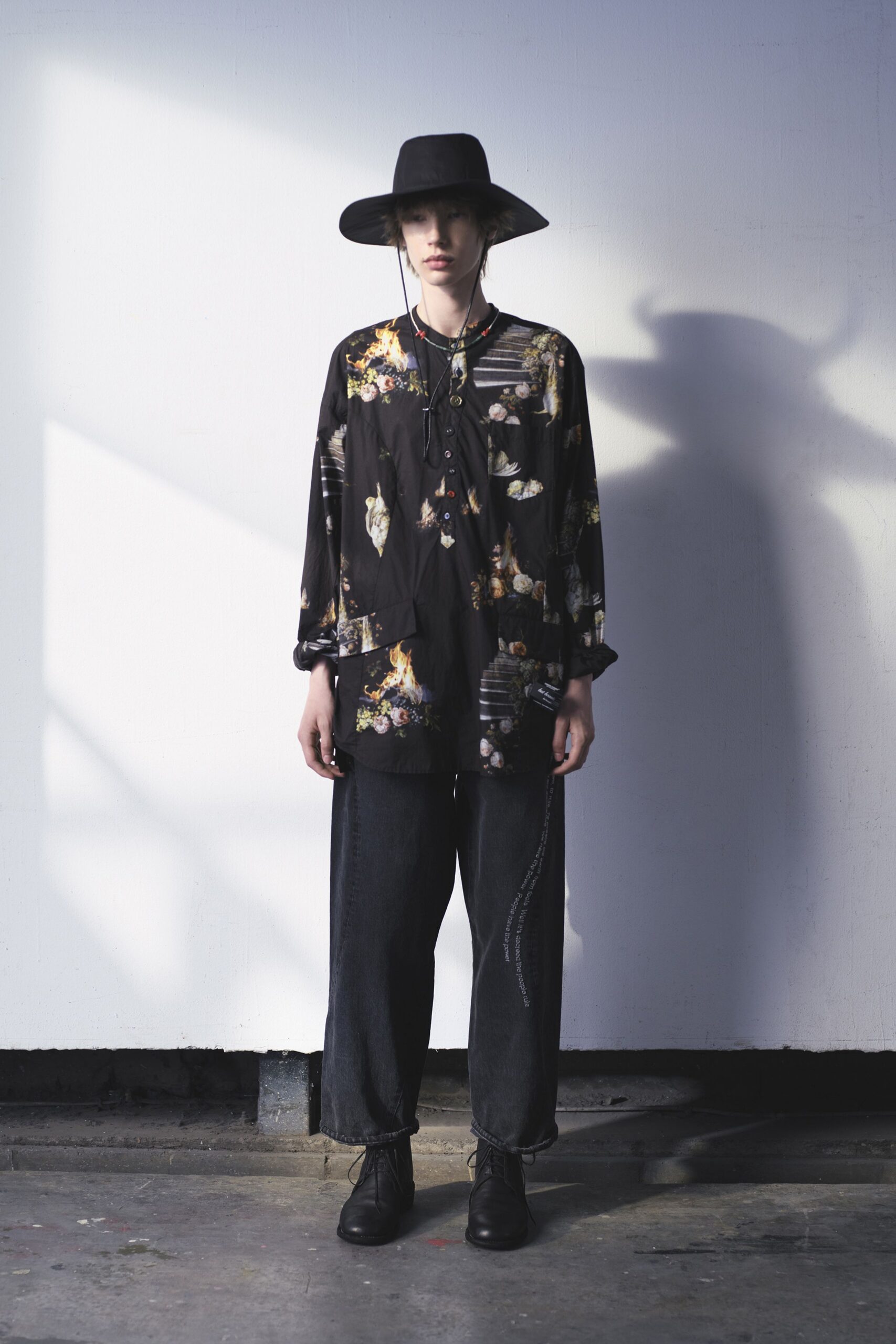 black floral shirt with wide-leg pants