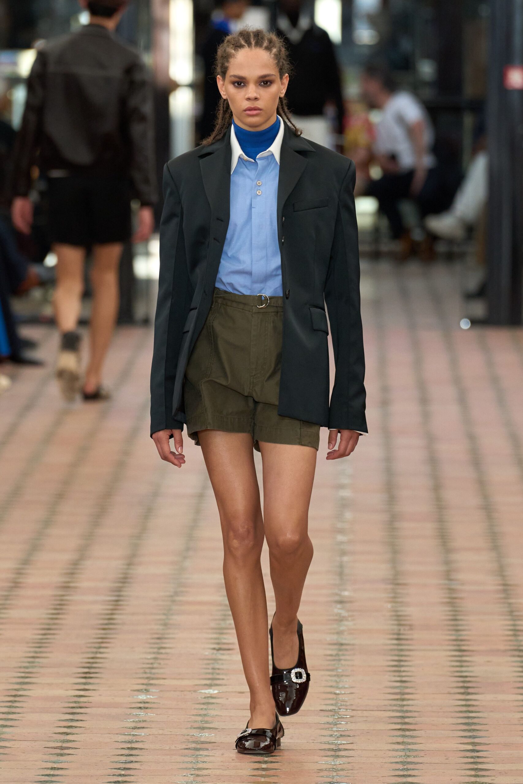 black blazer blue shirt green shorts