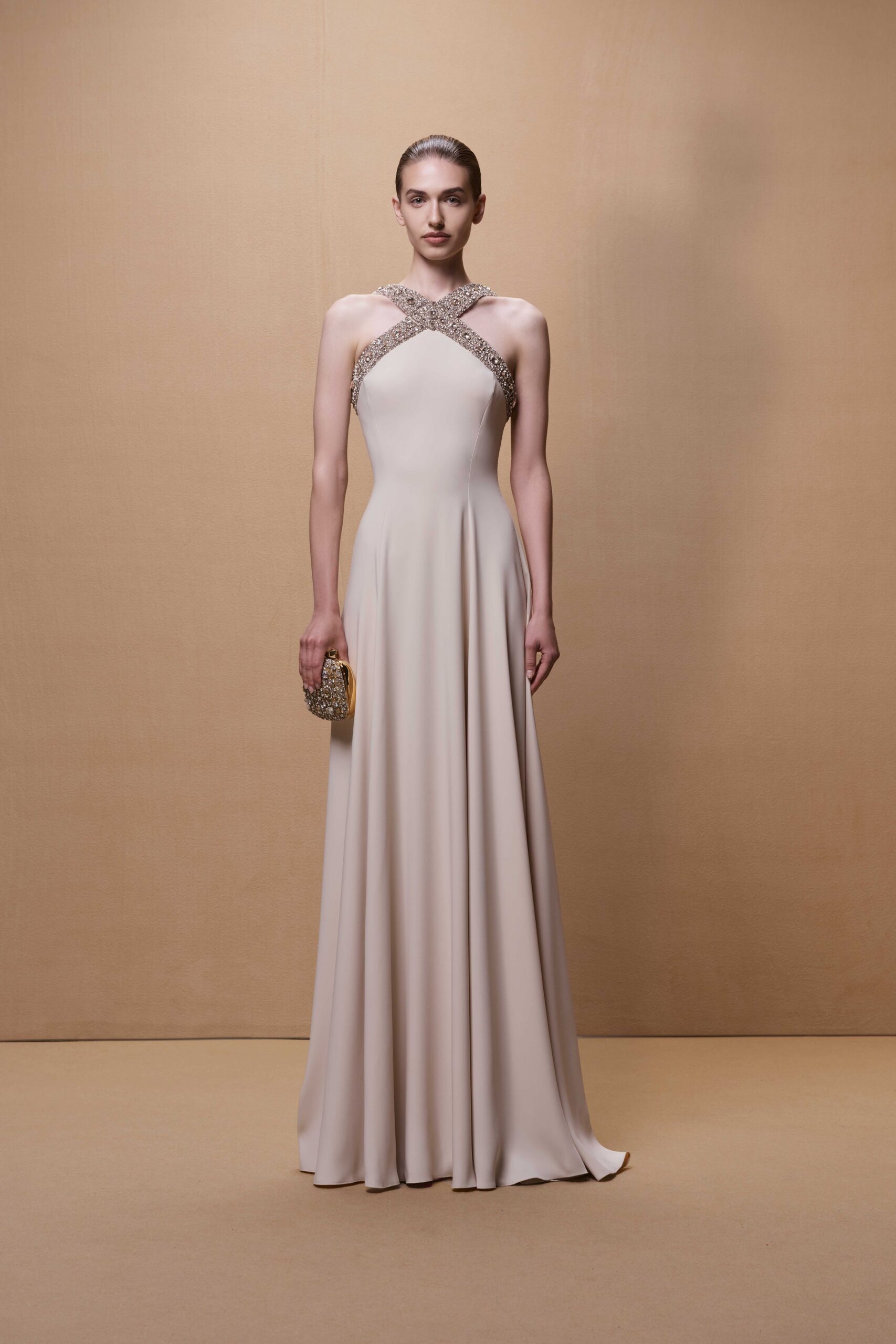 beige silk fitted gown with clutch
