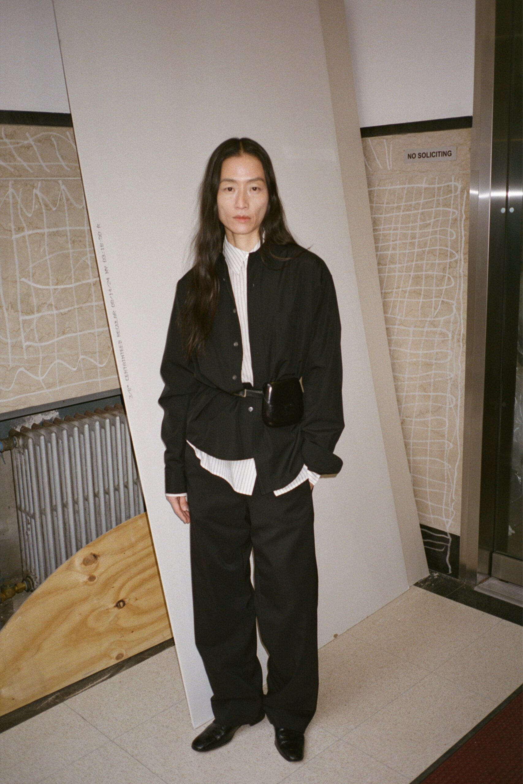 black relaxed jacket with striped shirt