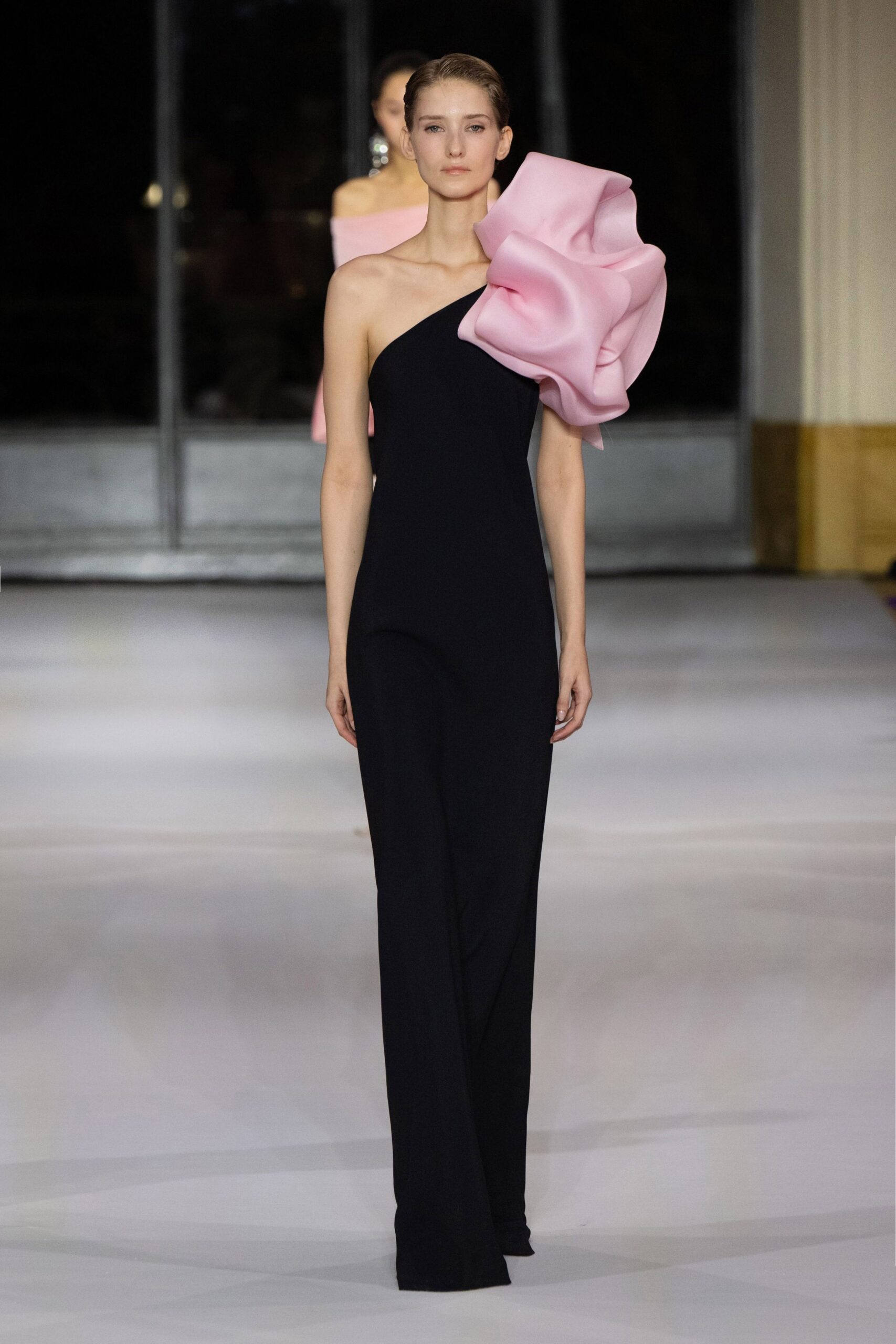 black and pink draped gowns