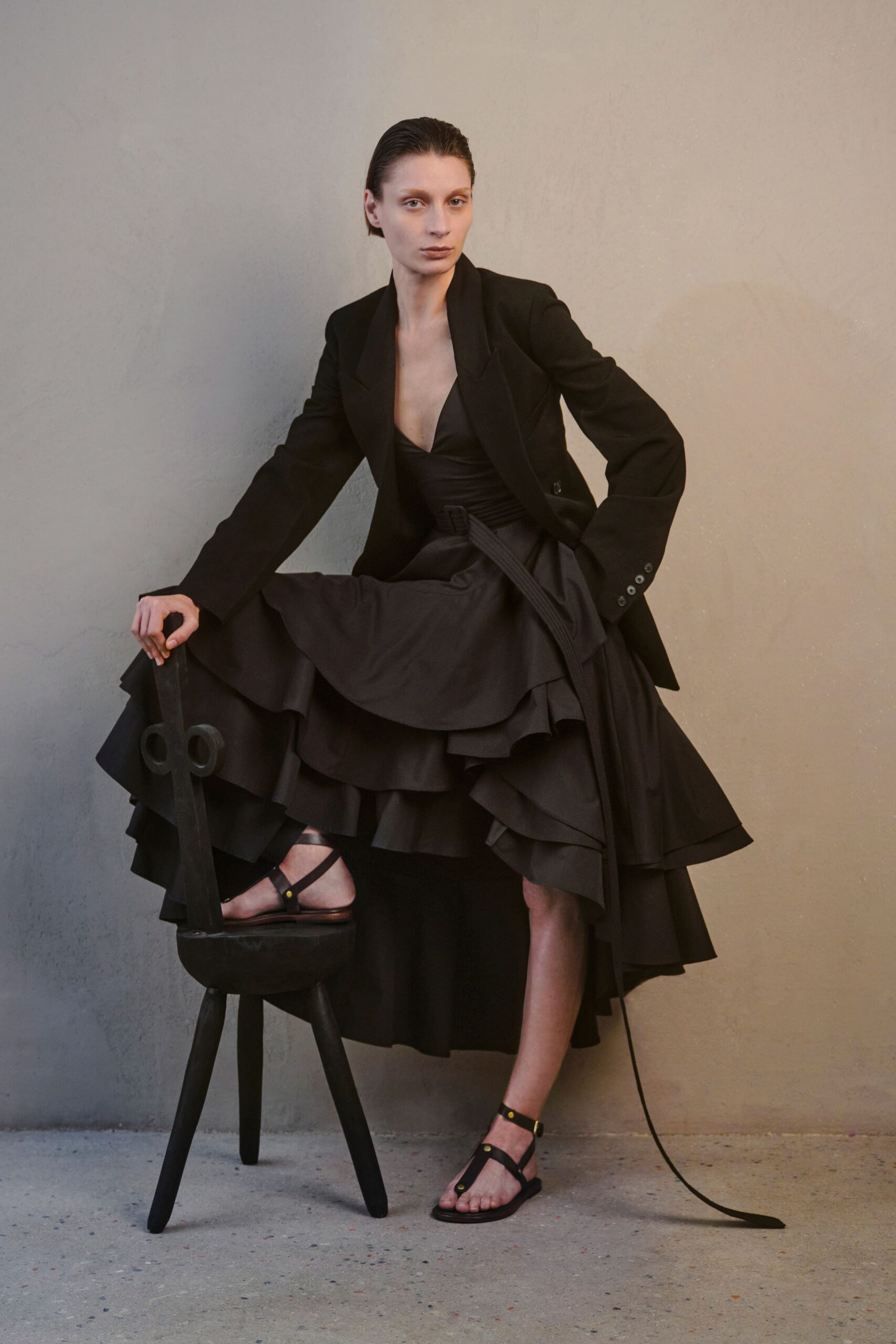 black tailored blazer and tiered dress