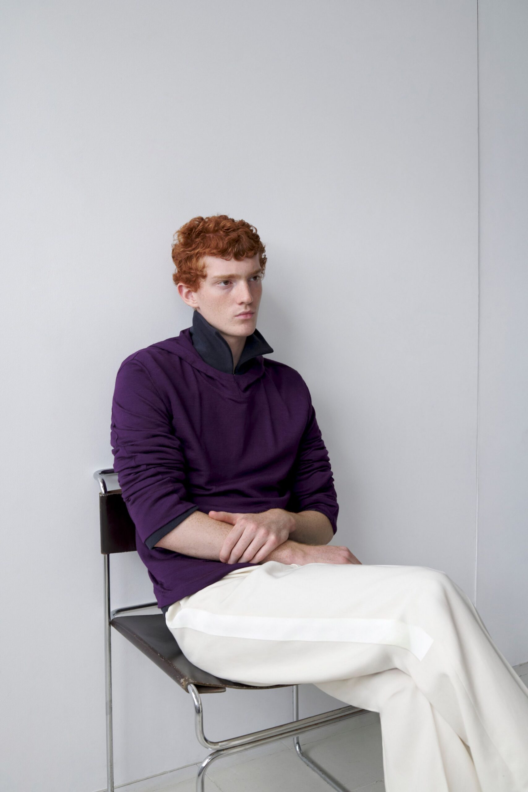 purple relaxed sweater and white pants