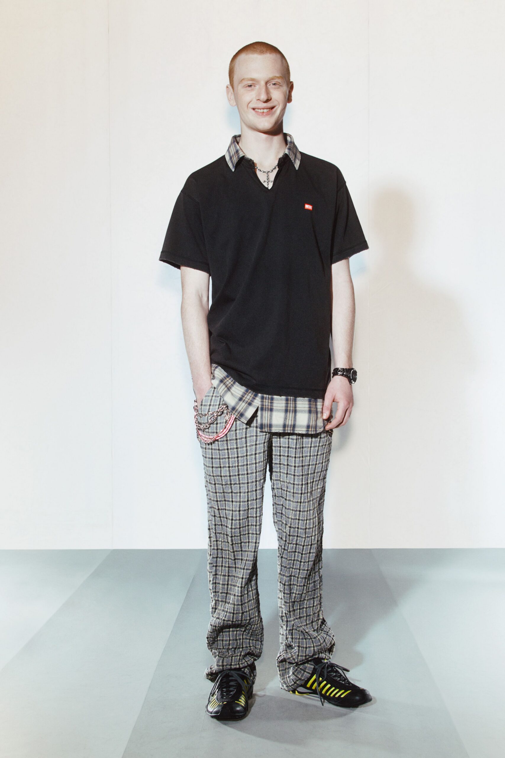 black t-shirt with checked shirt and pants