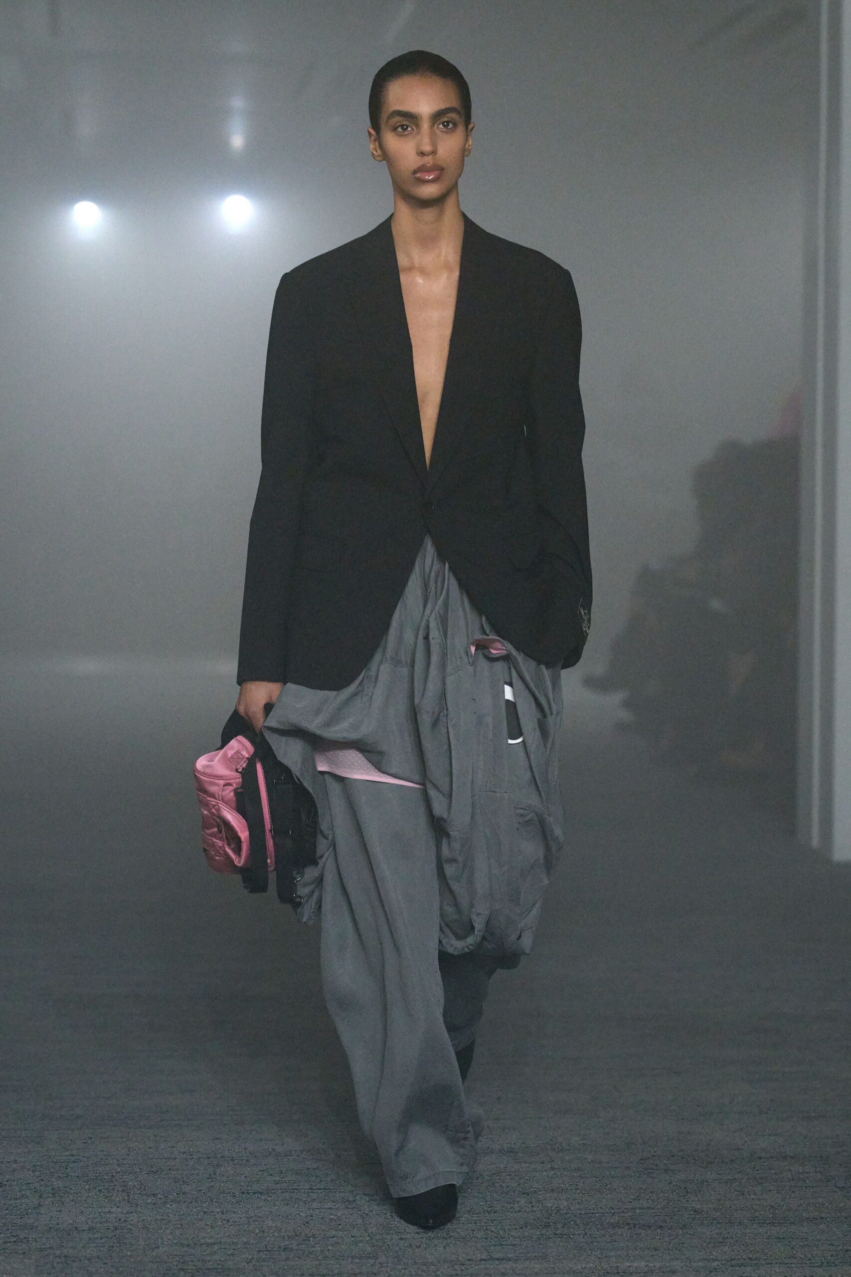 black blazer gray pants pink bag