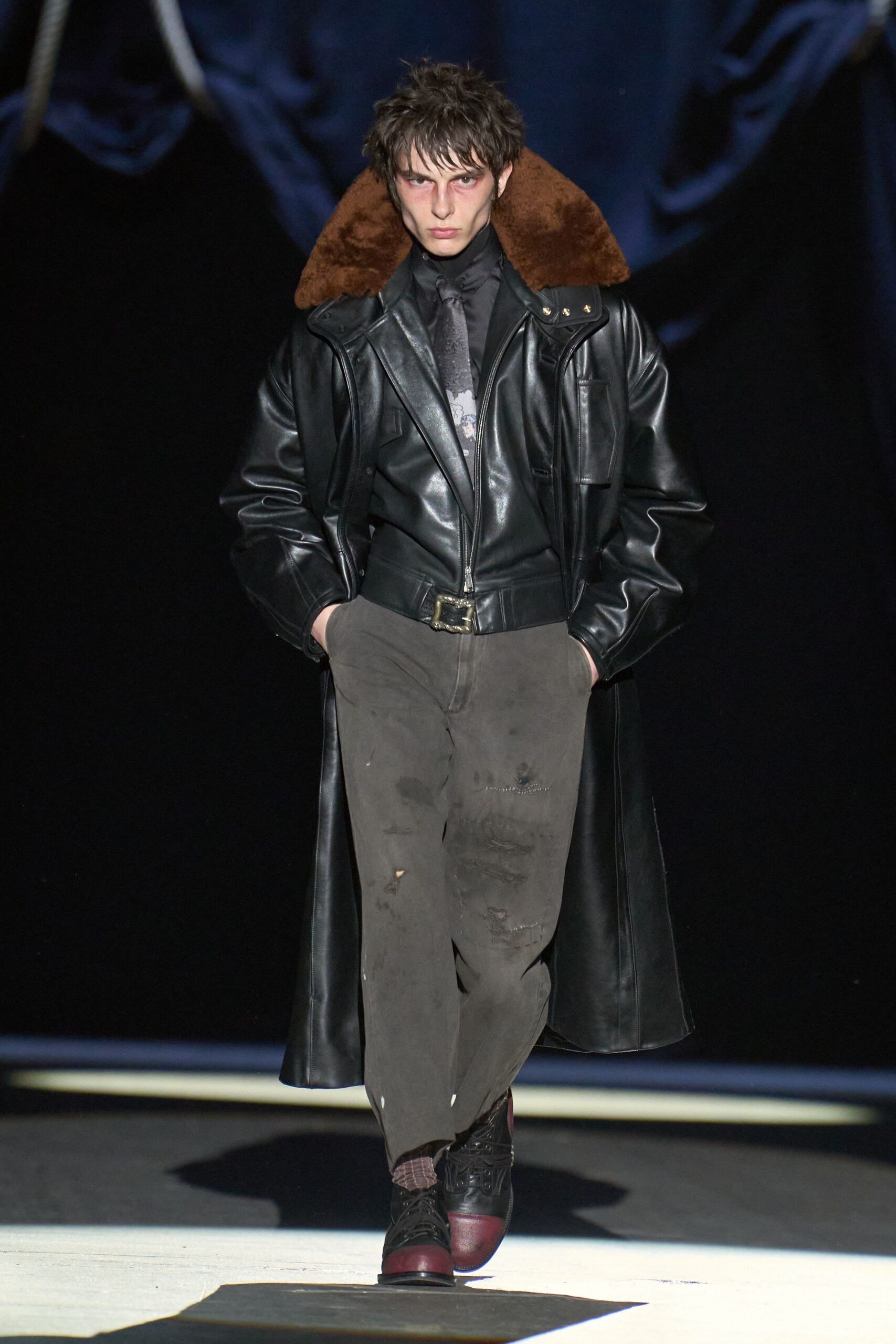 black leather coat with distressed pants