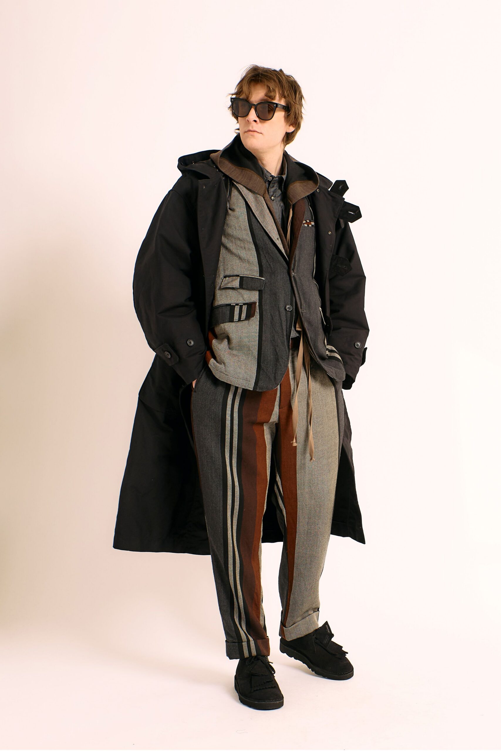 black coat gray blazer striped pants
