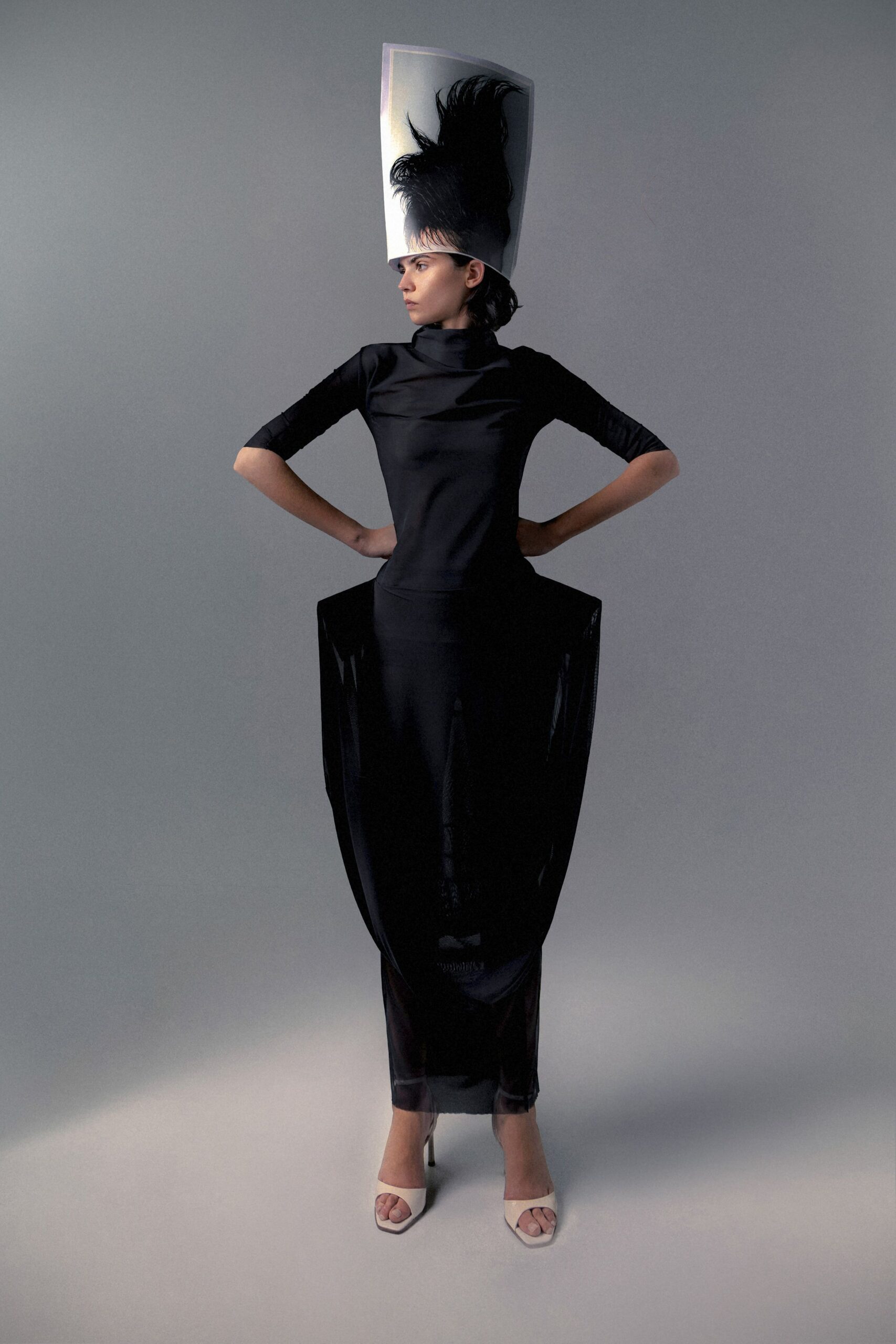 black silk fitted gown with white shoes