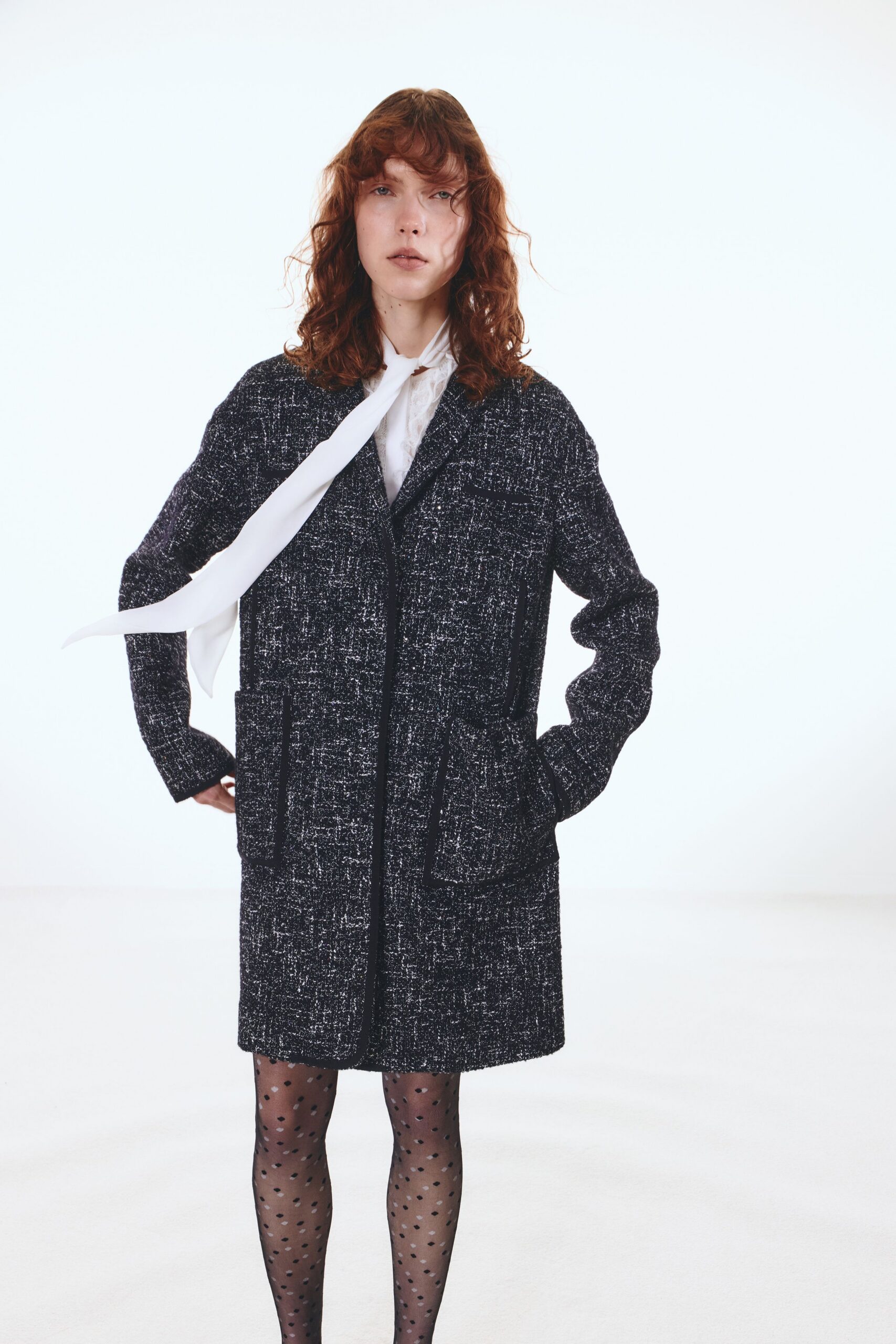 black tweed coat with white shirt