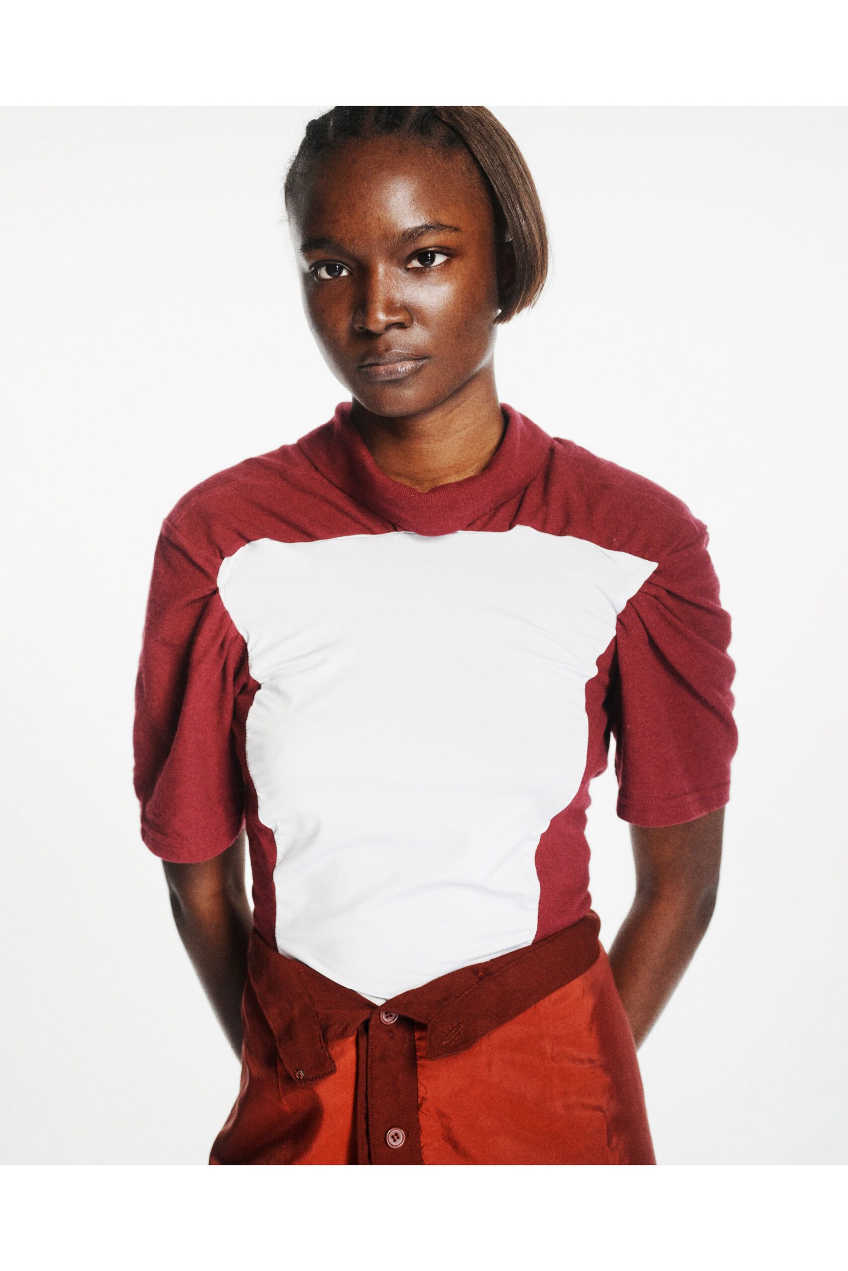 color-blocked red and white top with brown skirt