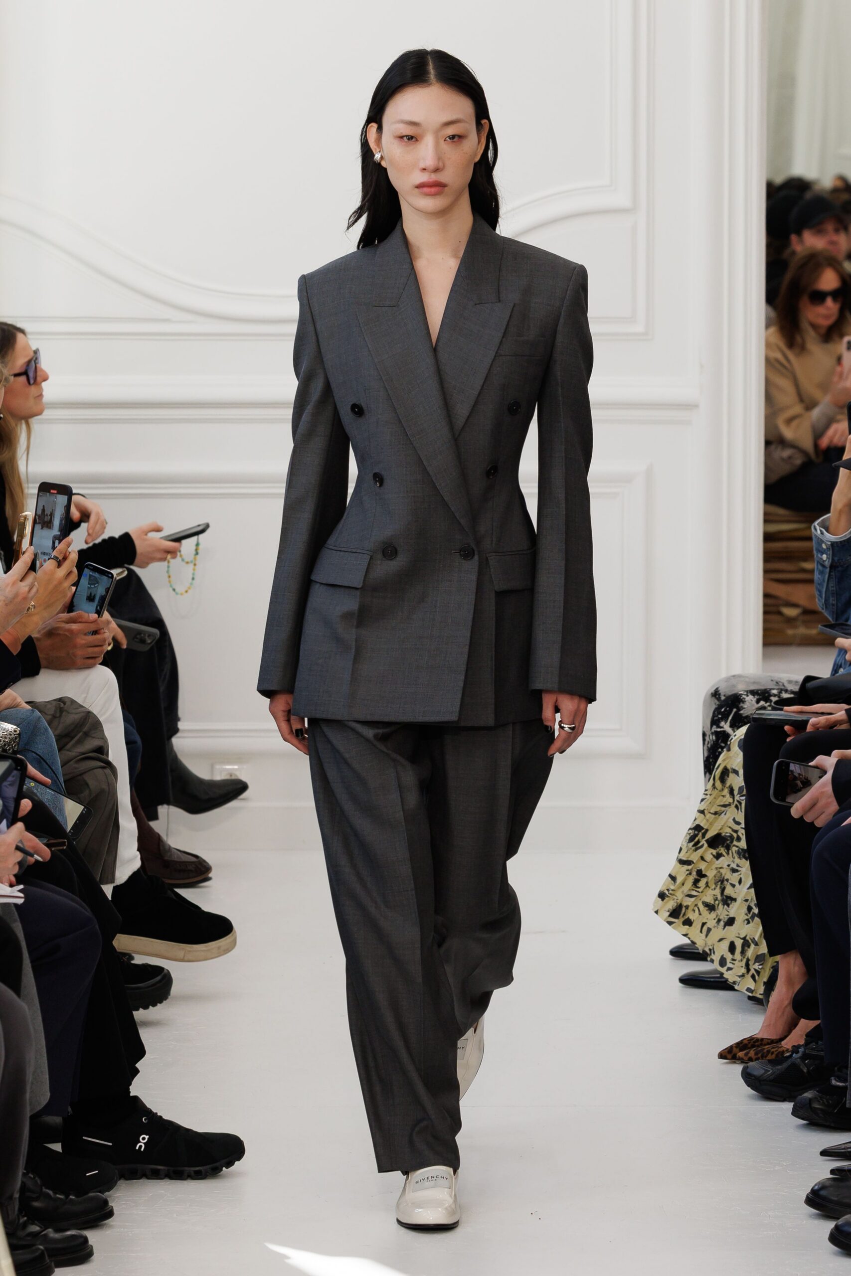 gray tailored suit with white shoes
