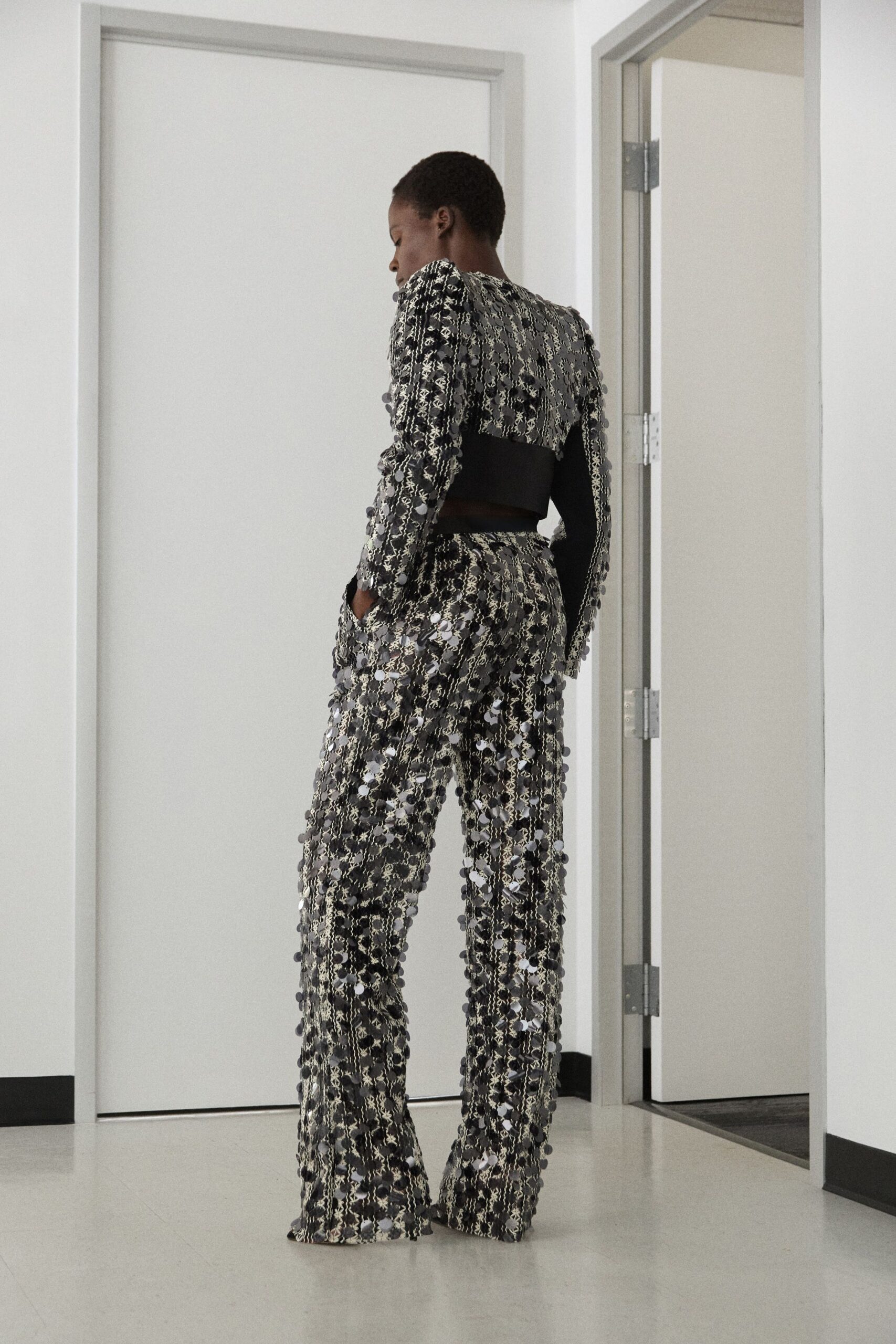 fringed black and white top with flared pants