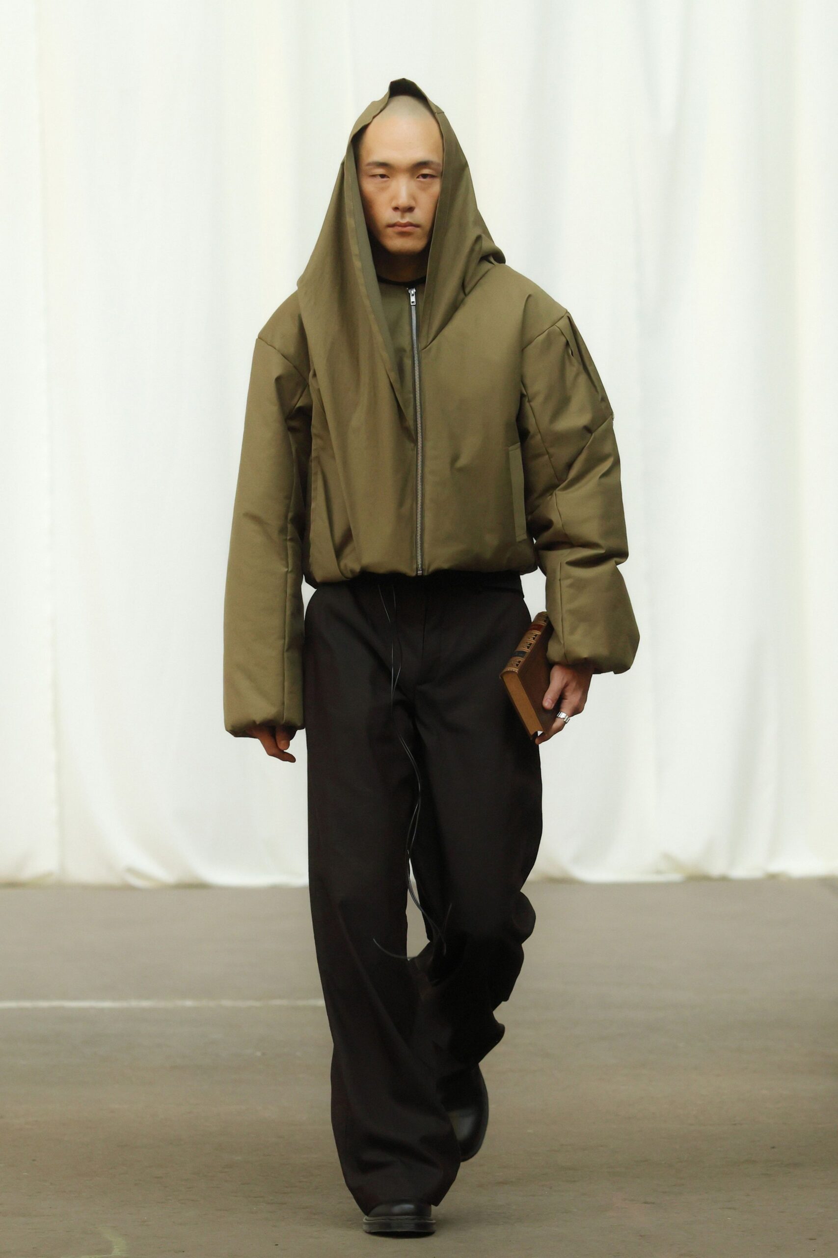 oversized green jacket with relaxed black pants