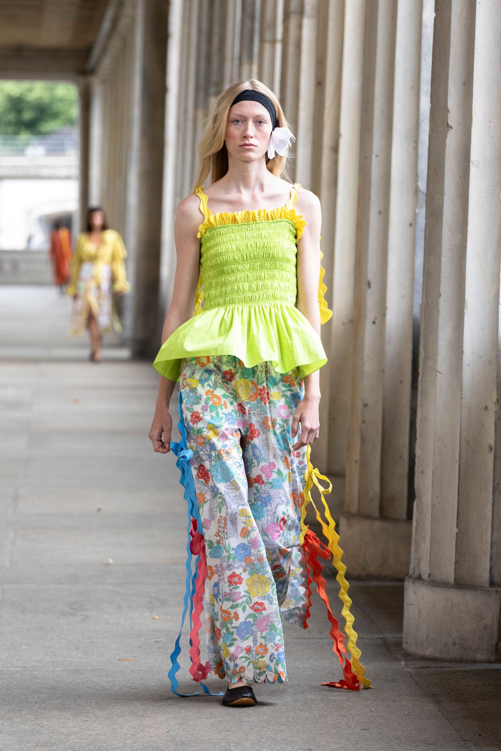 yellow fitted top with multi-colored pants