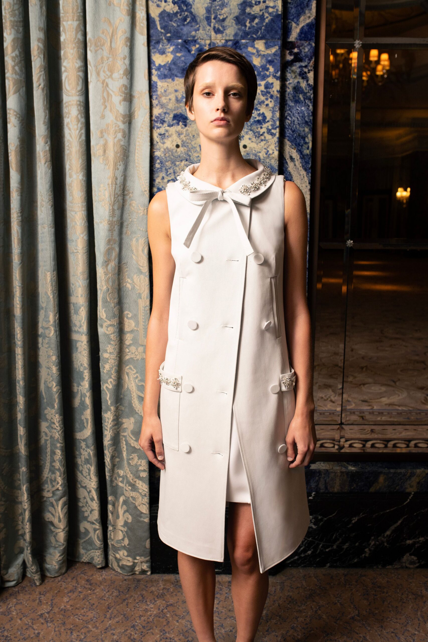 white fitted coat with collar