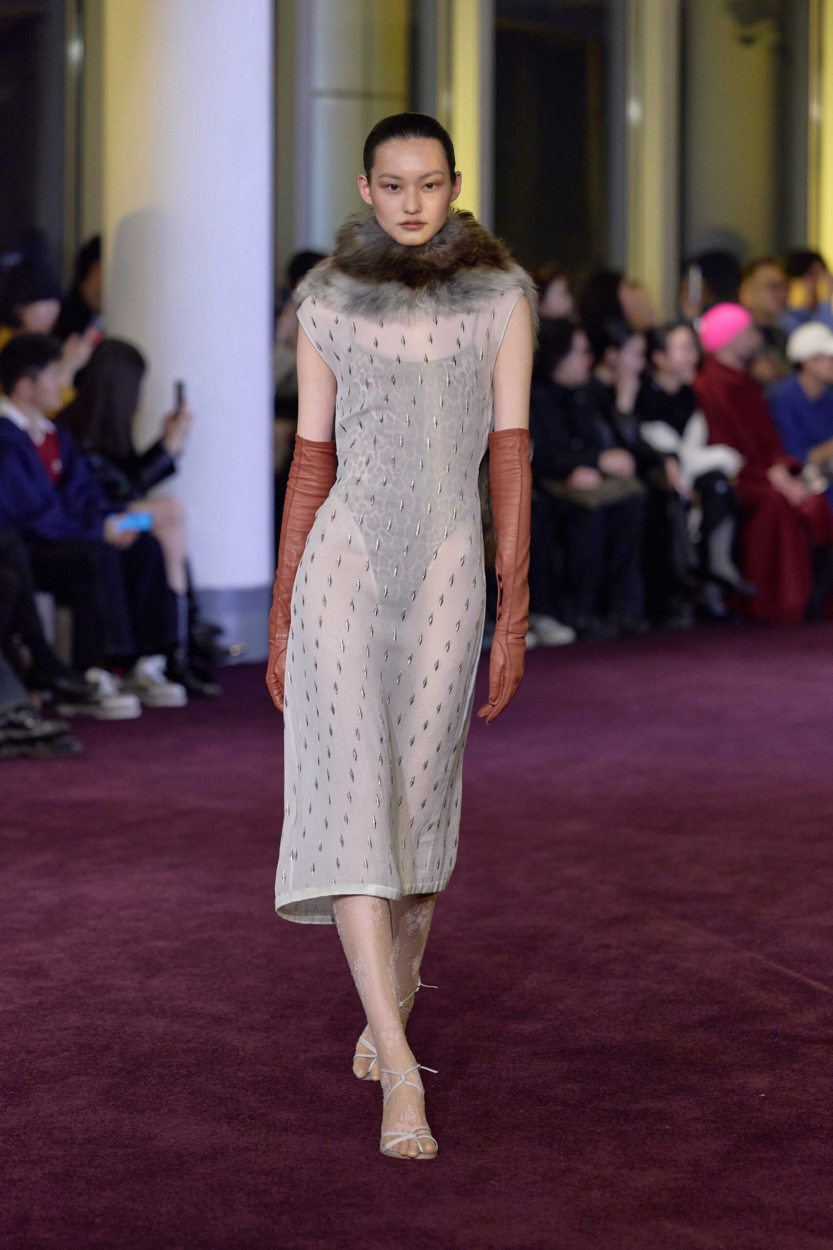 beige embroidered midi dress with red gloves