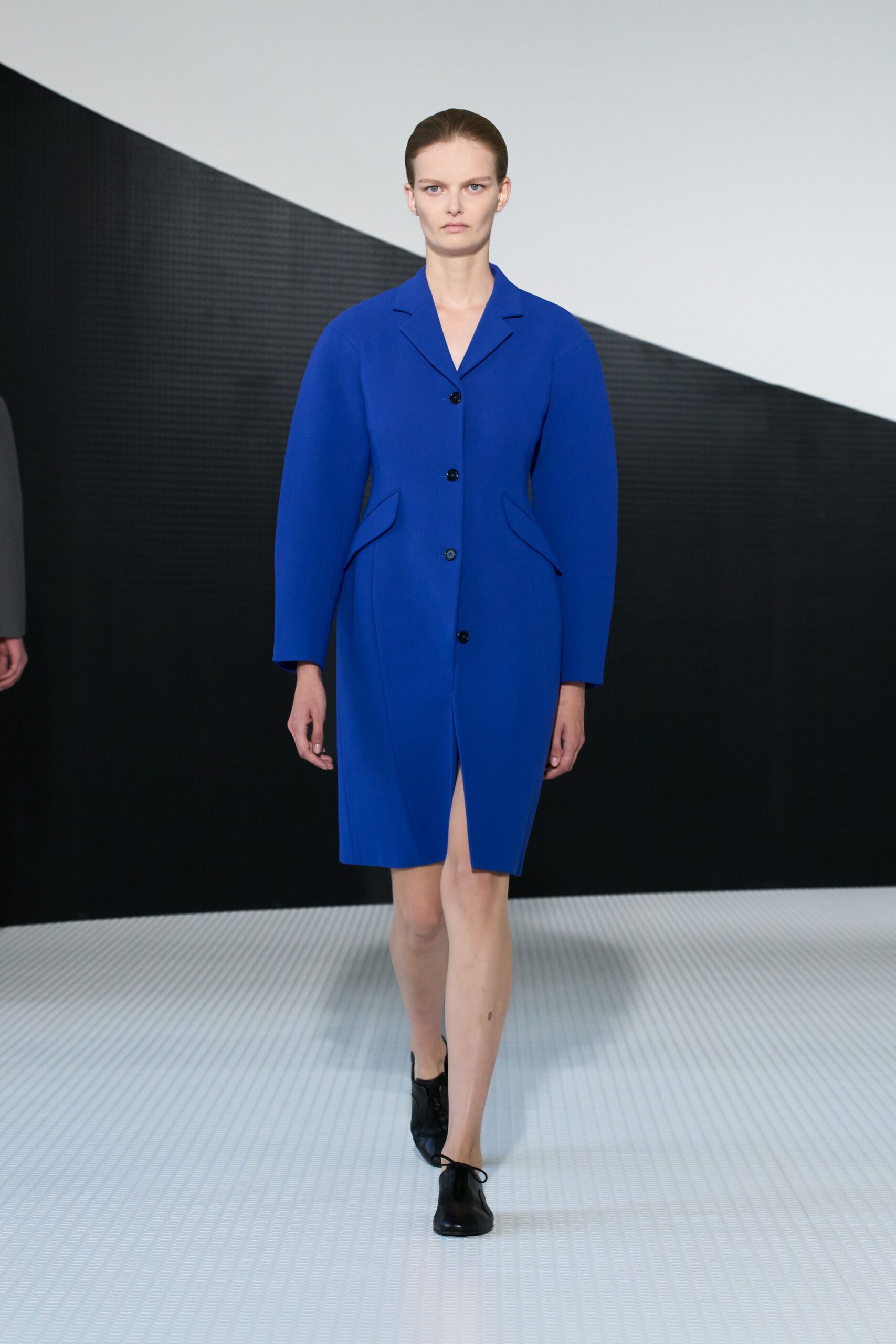 blue long-sleeve collared structured buttoned coat