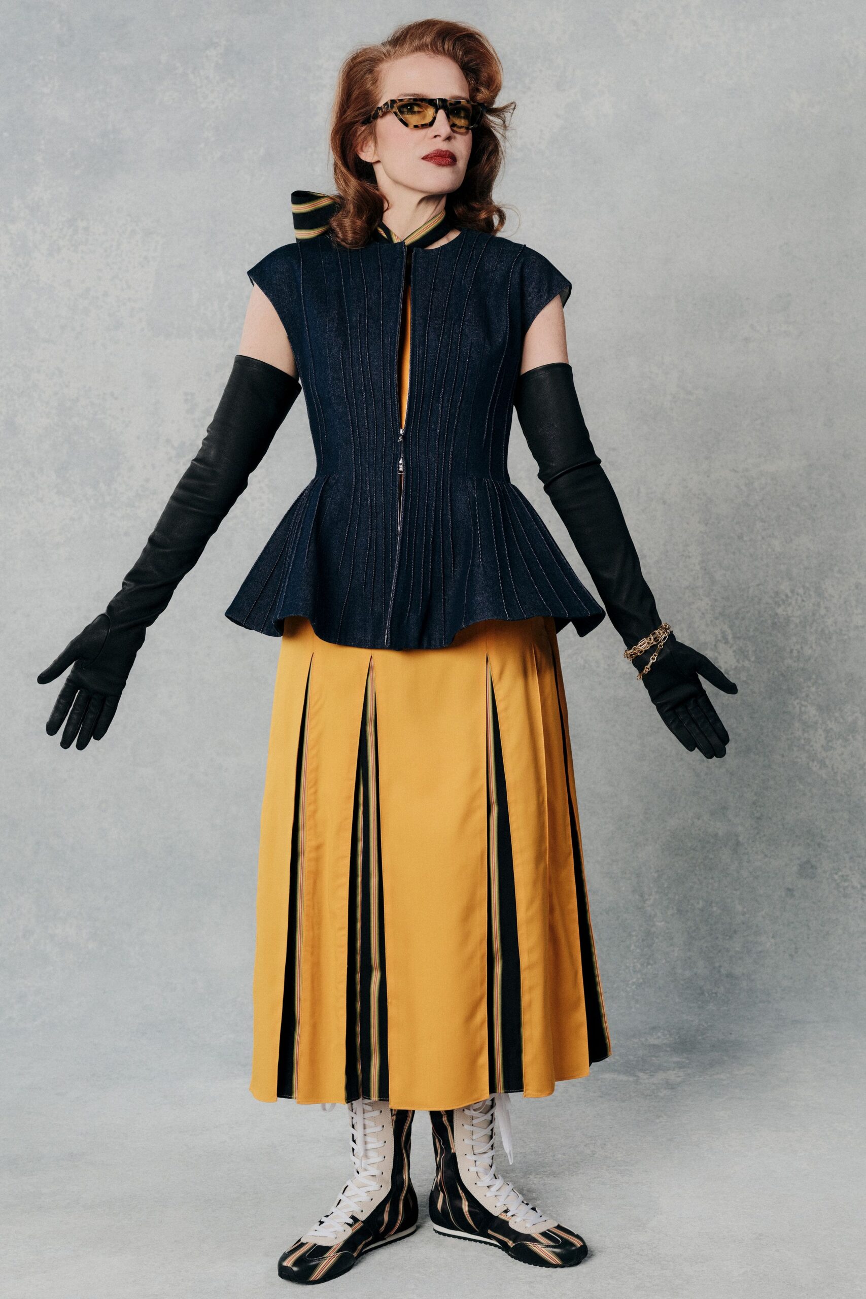 blue denim sleeveless high-neck fitted pleated top