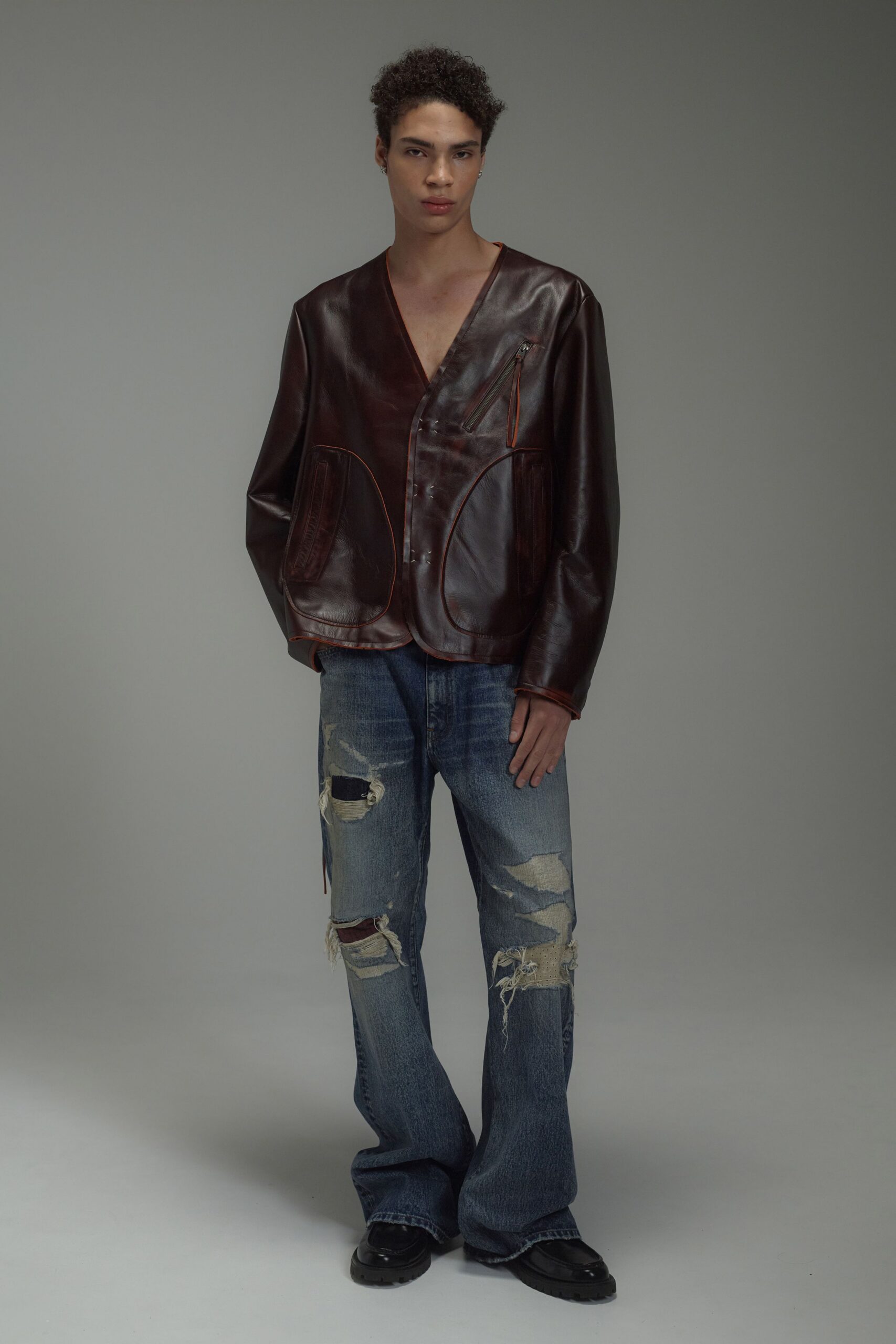 brown leather long-sleeve v-neck relaxed zippered pockets jacket