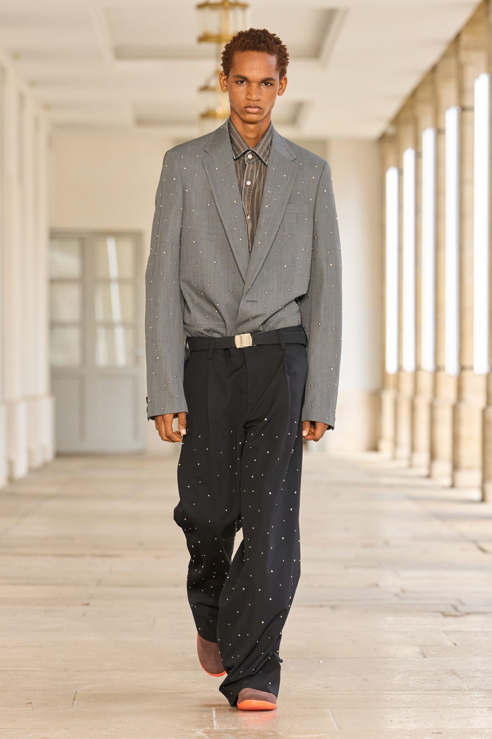 gray tailored blazer with black shirt