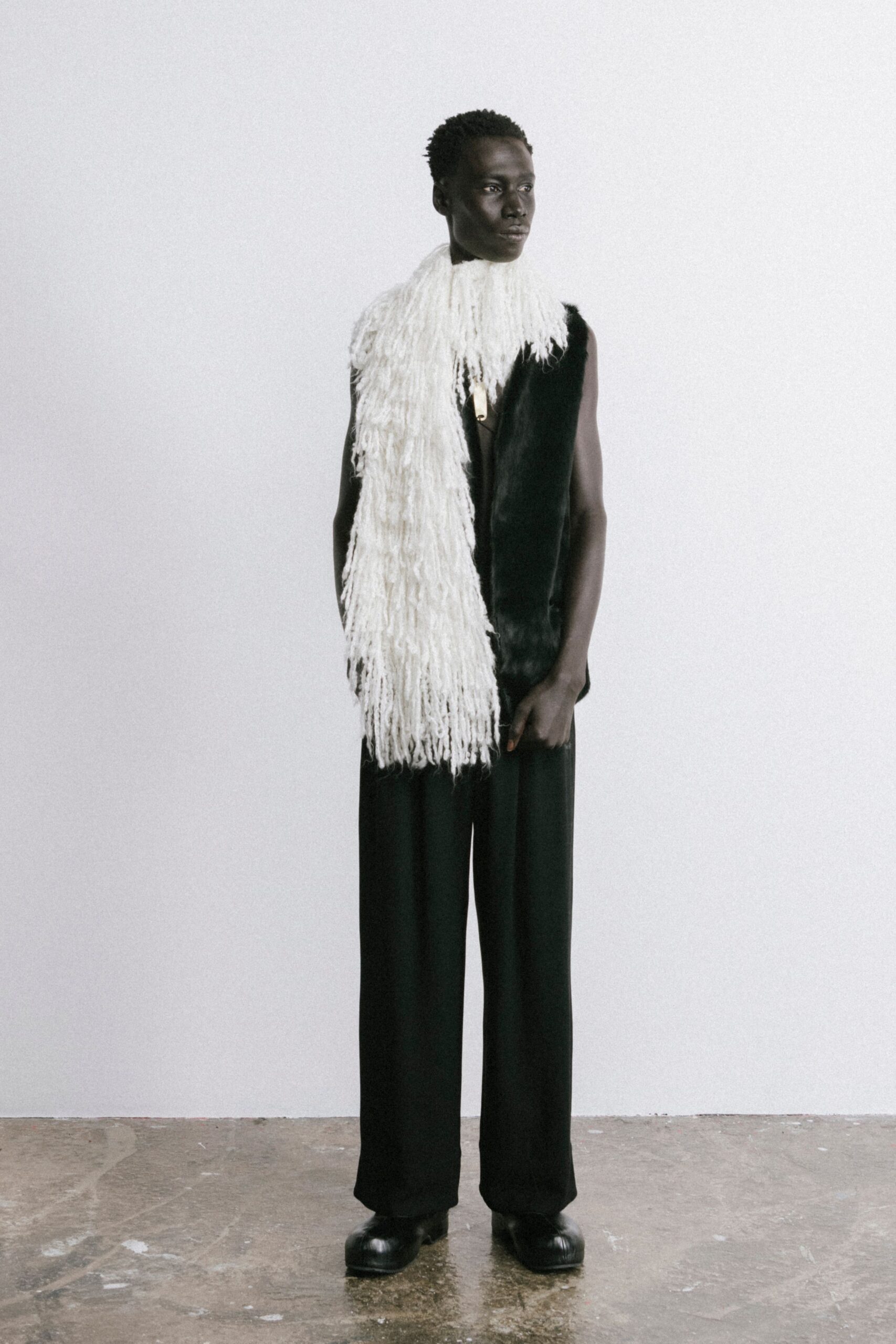 black fur sleeveless fitted fringed vest