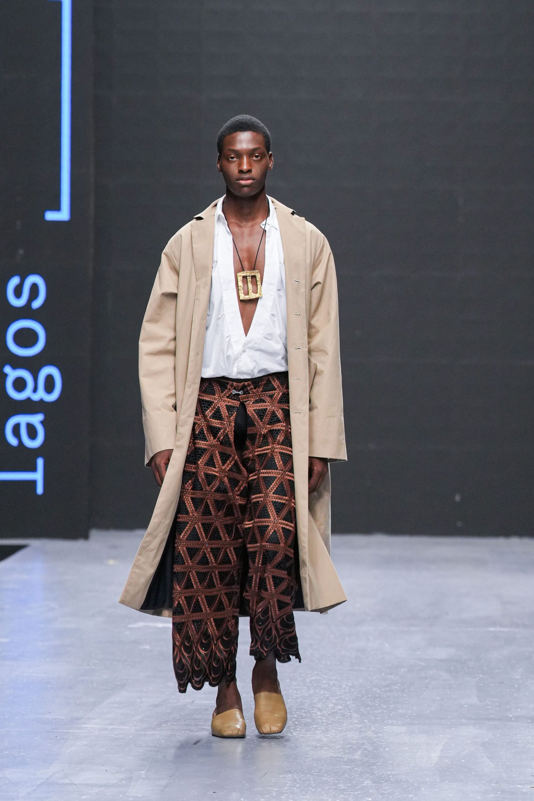 beige coat white shirt printed pants