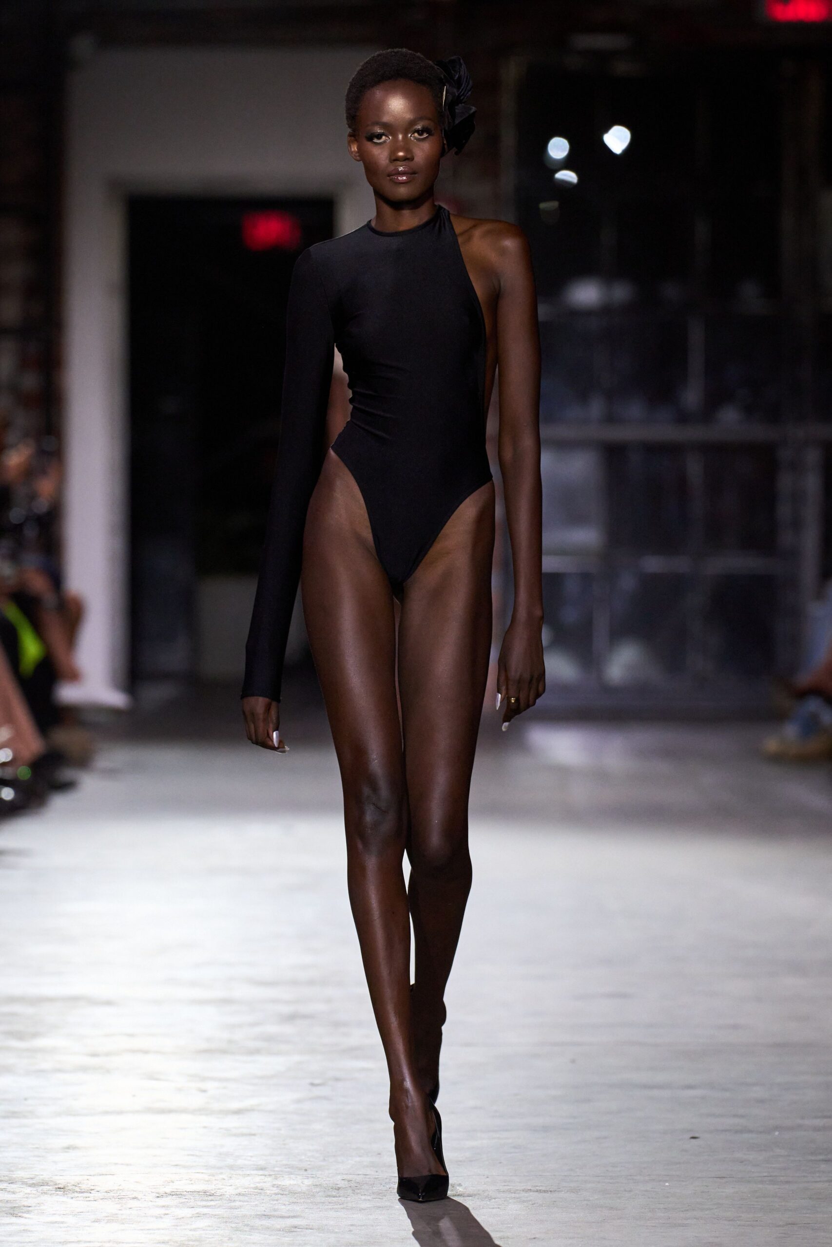 black fitted bodysuit with heels